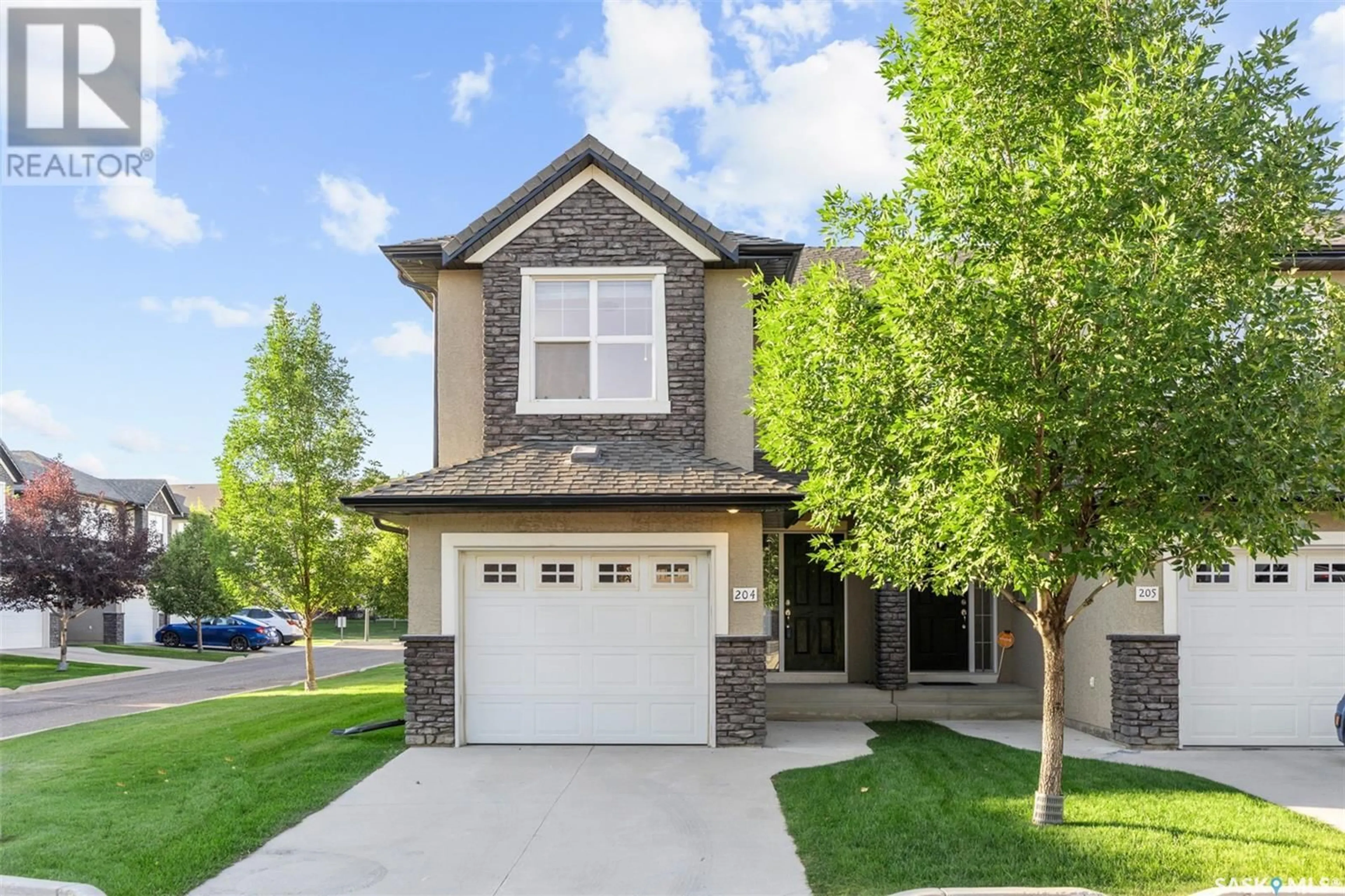Home with brick exterior material, street for 204 - 410 HUNTER ROAD, Saskatoon Saskatchewan S7T0L5