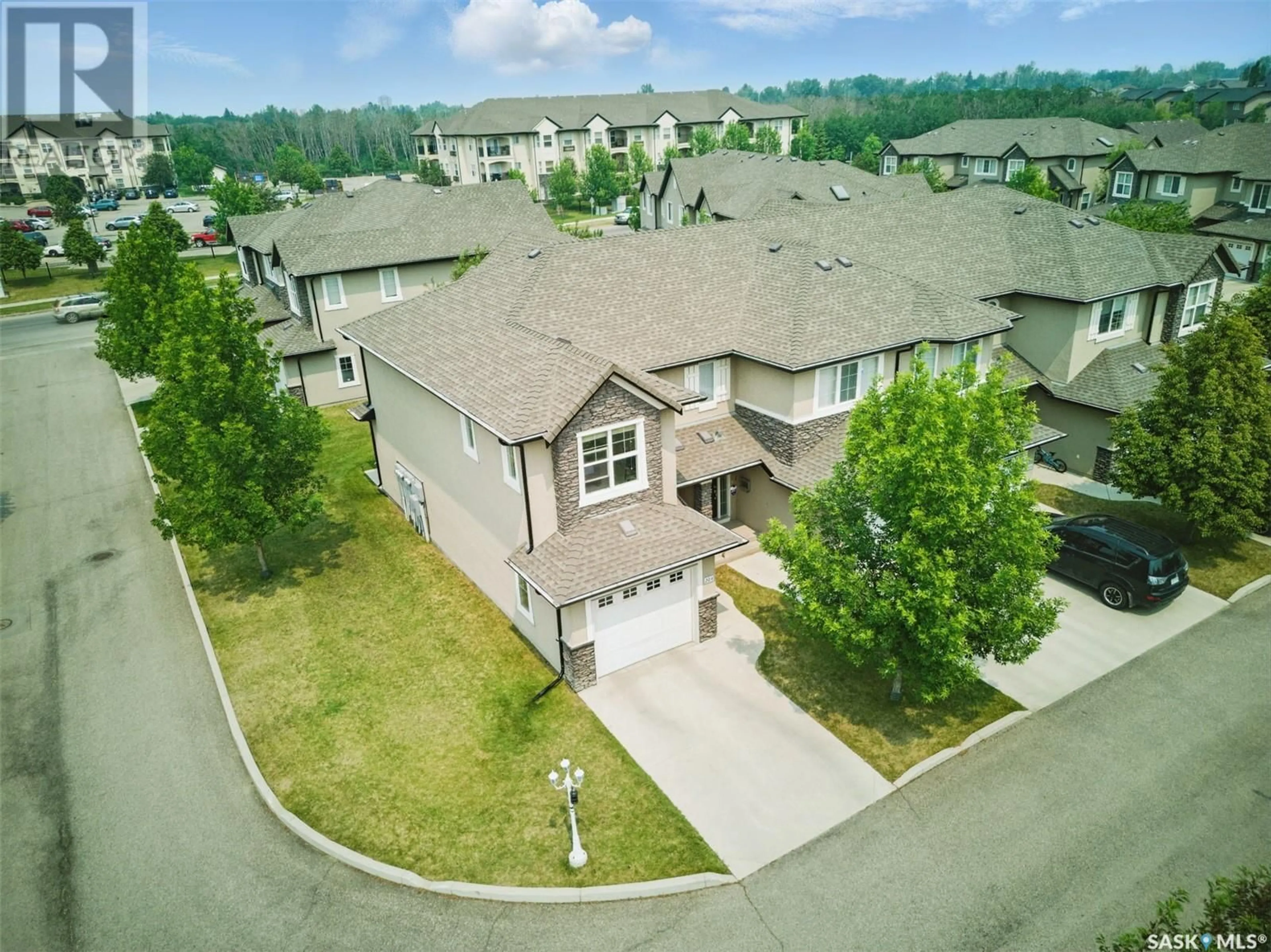 A pic from outside/outdoor area/front of a property/back of a property/a pic from drone, street for 204 - 410 HUNTER ROAD, Saskatoon Saskatchewan S7T0L5