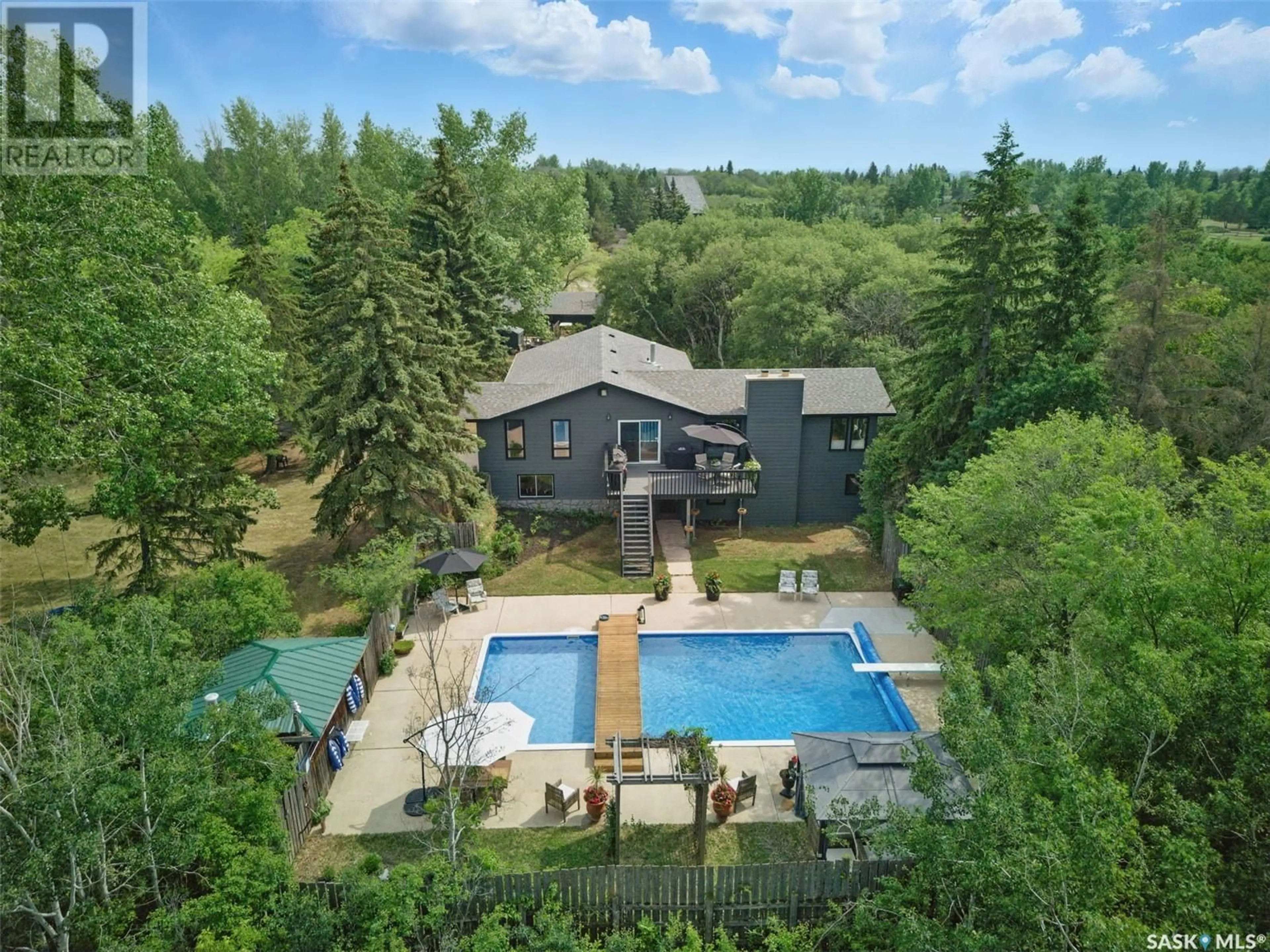 A pic from outside/outdoor area/front of a property/back of a property/a pic from drone, unknown for 14 PONY TRAIL, Corman Park Rm No. 344 Saskatchewan S7T1A1