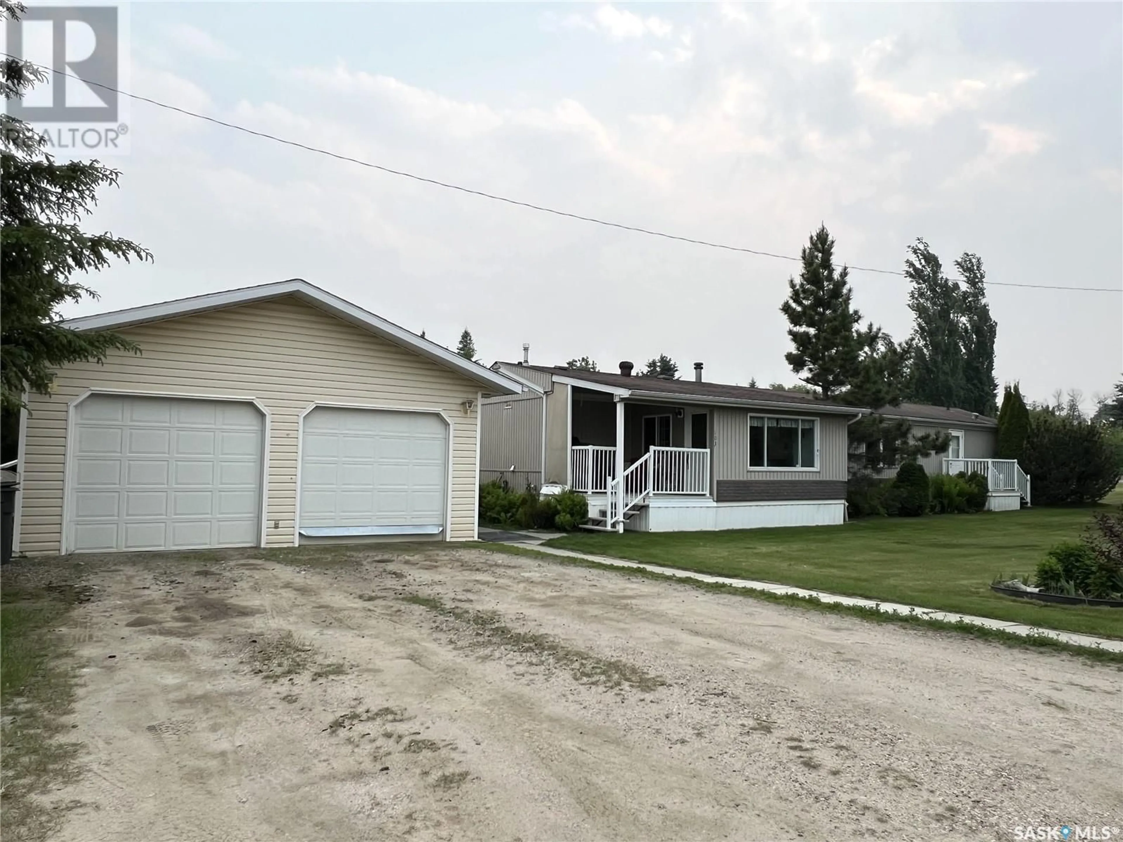 Home with vinyl exterior material, street for 103 MAIN STREET, Dorintosh Saskatchewan S0M0T0