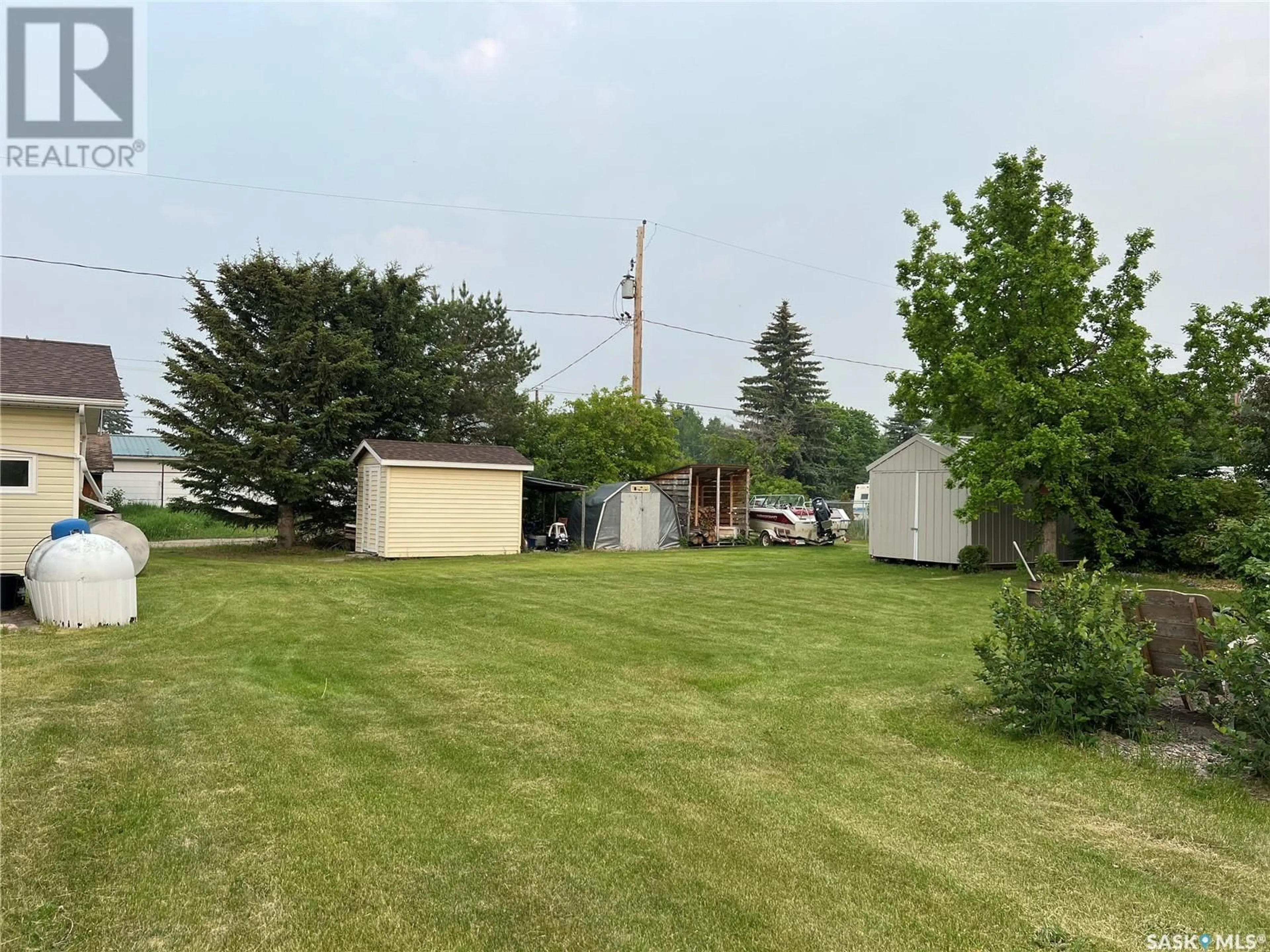 A pic from outside/outdoor area/front of a property/back of a property/a pic from drone, unknown for 103 MAIN STREET, Dorintosh Saskatchewan S0M0T0