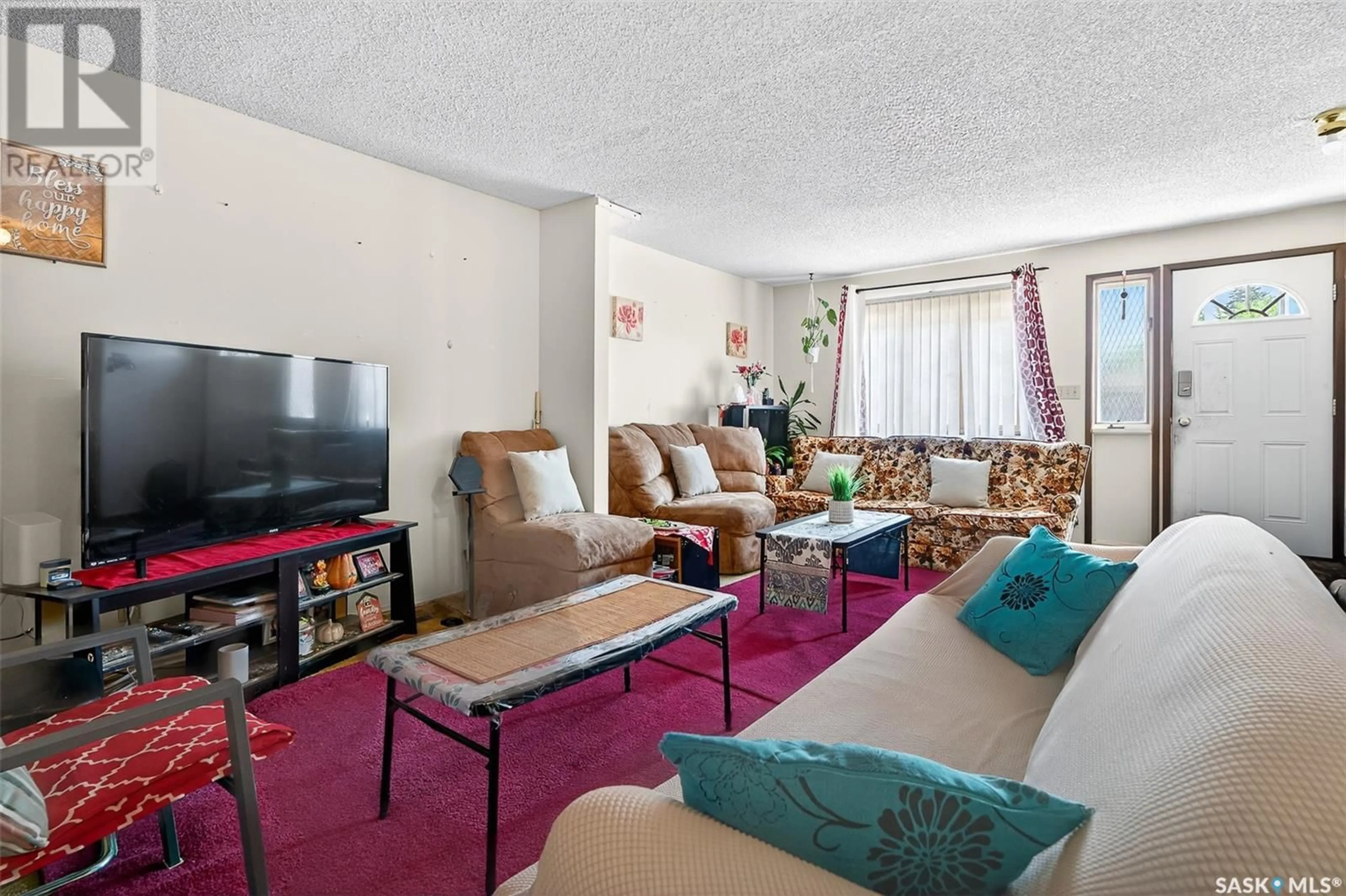 Living room with furniture, carpet floor for 1058 CARIBOU STREET, Moose Jaw Saskatchewan S6H2L7