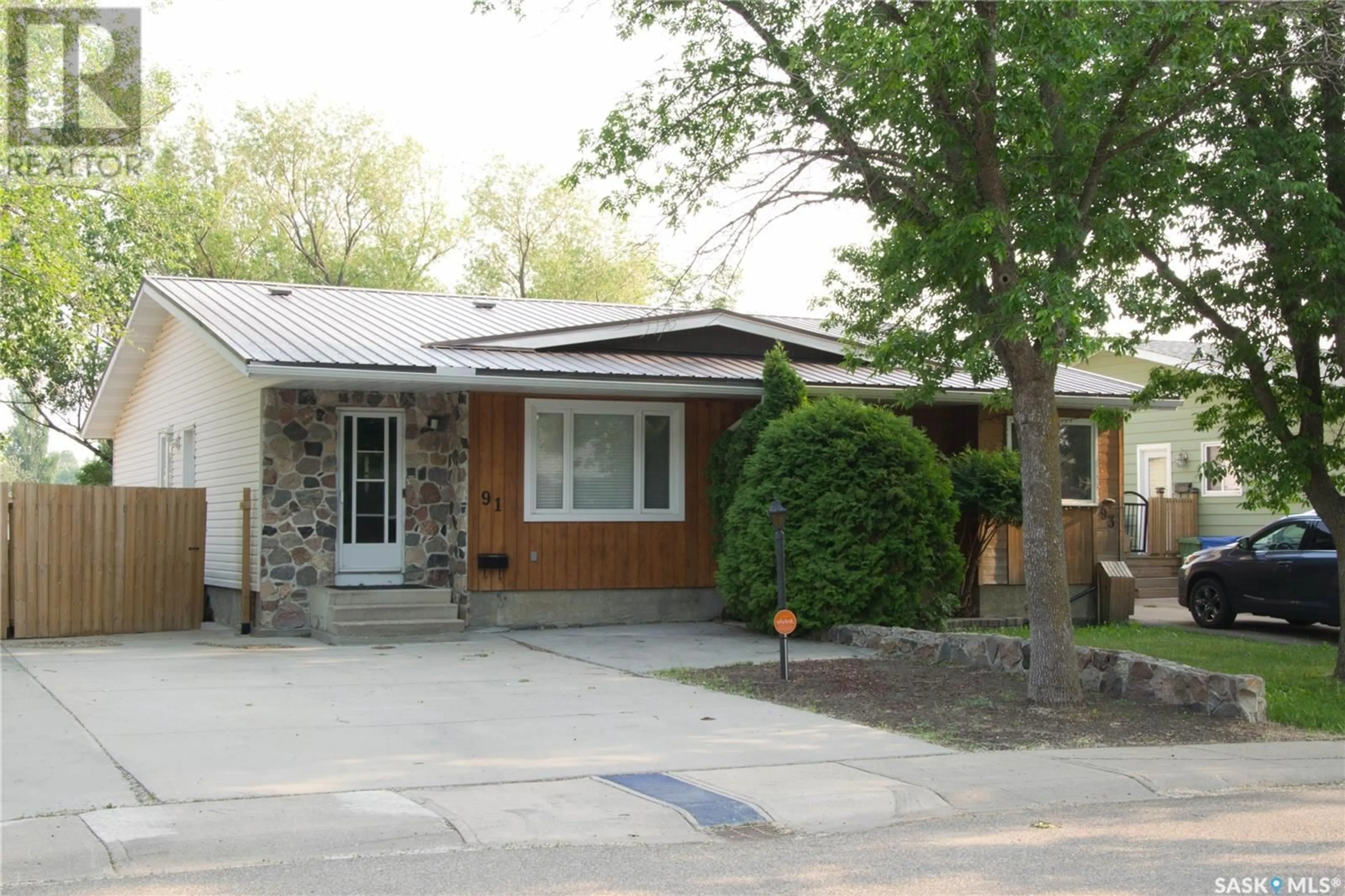 Home with brick exterior material, street for 91 CHURCH DRIVE, Regina Saskatchewan S4X1L7