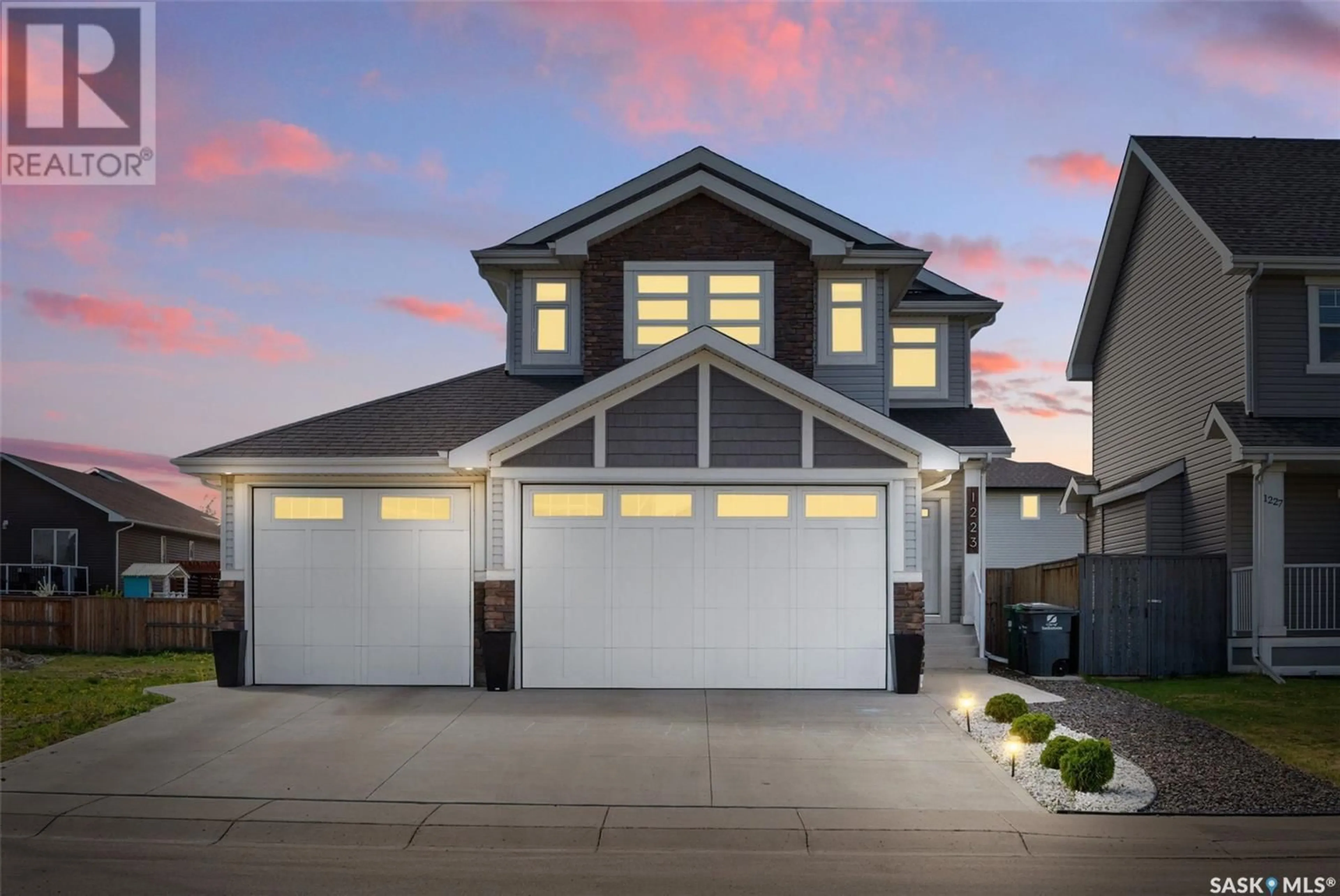 Home with vinyl exterior material, street for 1223 PRINGLE WAY, Saskatoon Saskatchewan S7T0V5