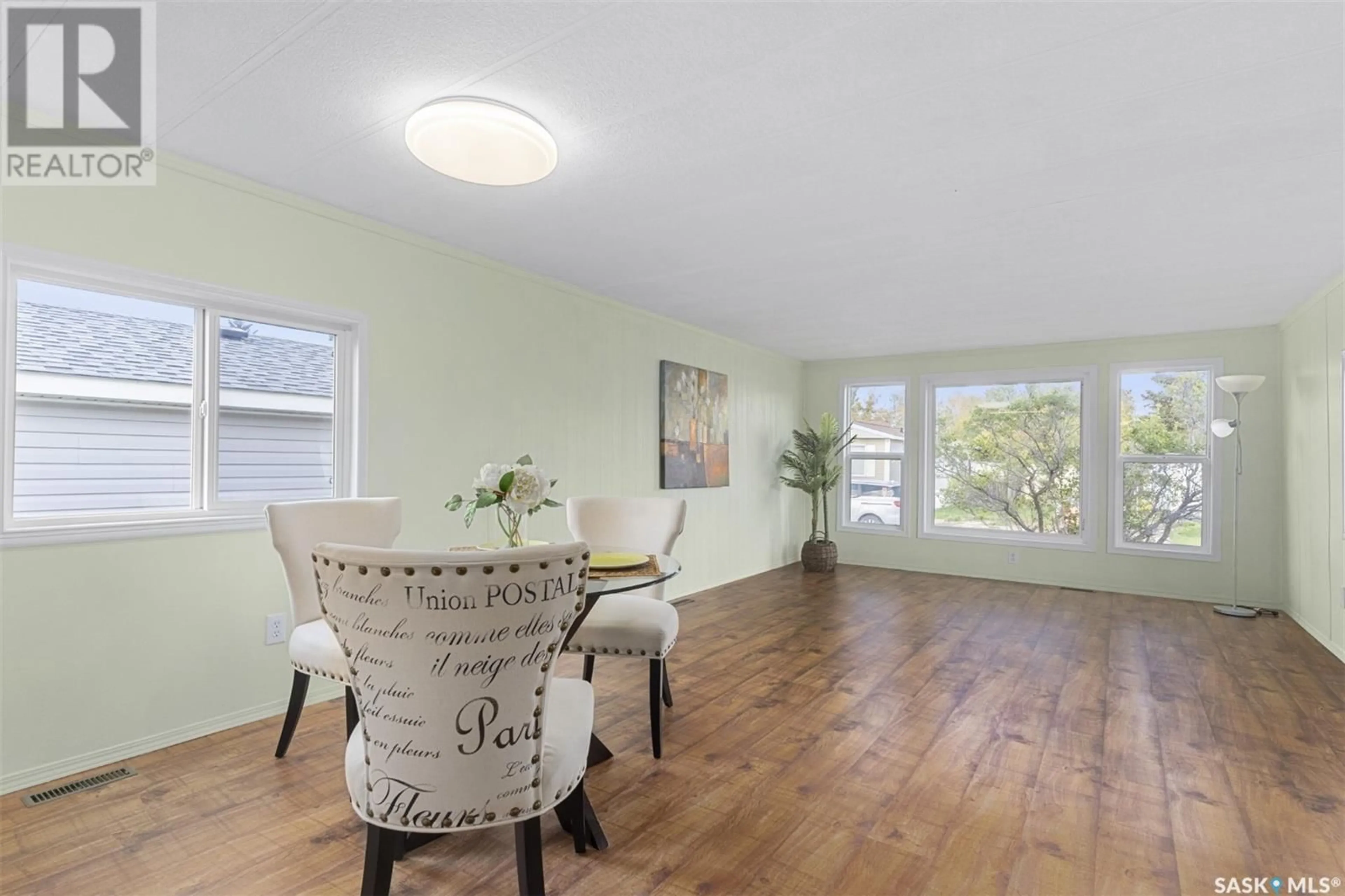 Living room with furniture, wood/laminate floor for 229 CYPRESS WAY, Blucher Rm No. 343 Saskatchewan S7B0A4
