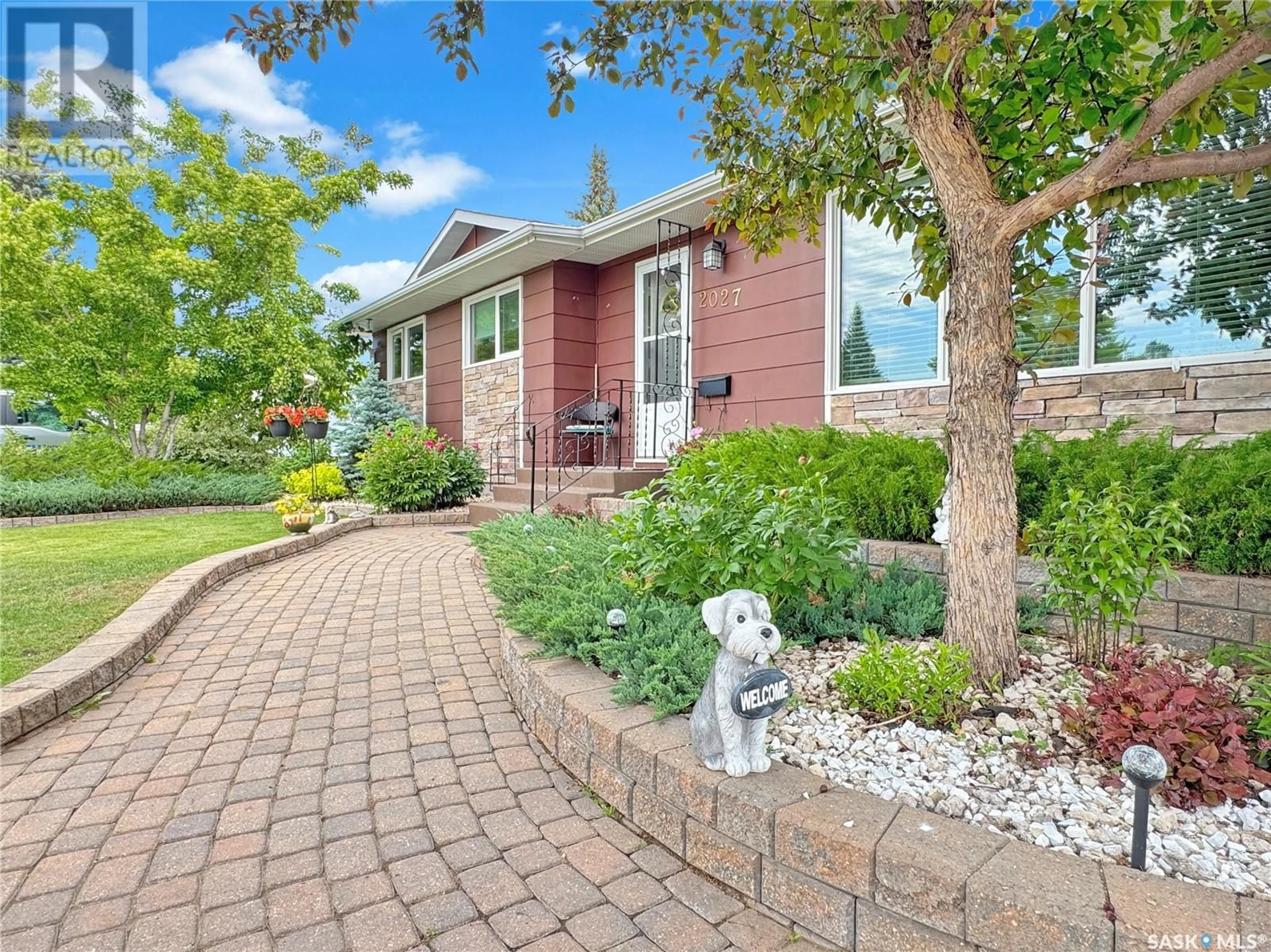 Home with brick exterior material, street for 2027 FOLEY DRIVE, North Battleford Saskatchewan S9A3H1