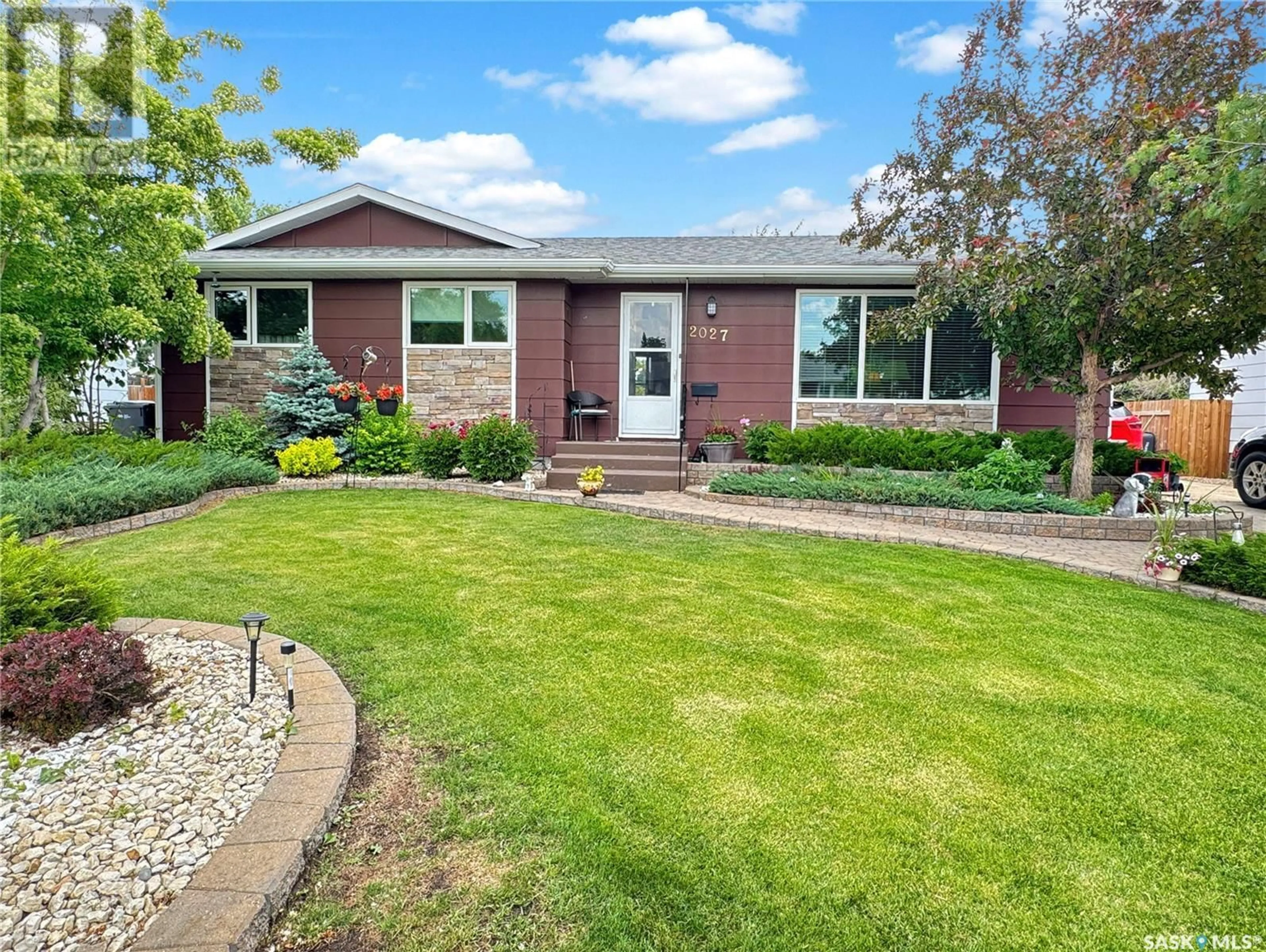 Home with brick exterior material, street for 2027 FOLEY DRIVE, North Battleford Saskatchewan S9A3H1