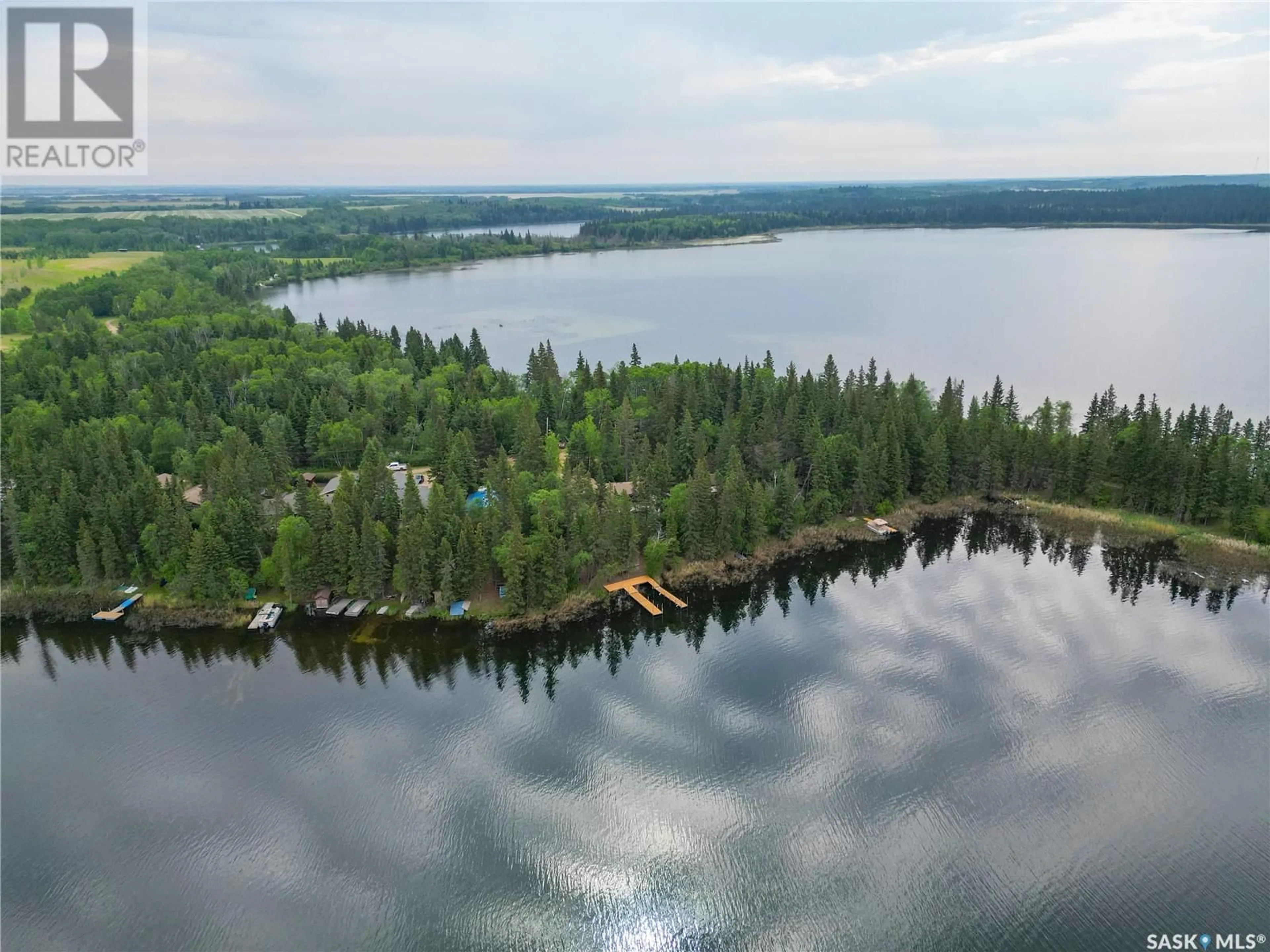 A pic from outside/outdoor area/front of a property/back of a property/a pic from drone, water/lake/river/ocean view for 224 KINGFISHER DRIVE, Canwood Rm No. 494 Saskatchewan S0J0K0