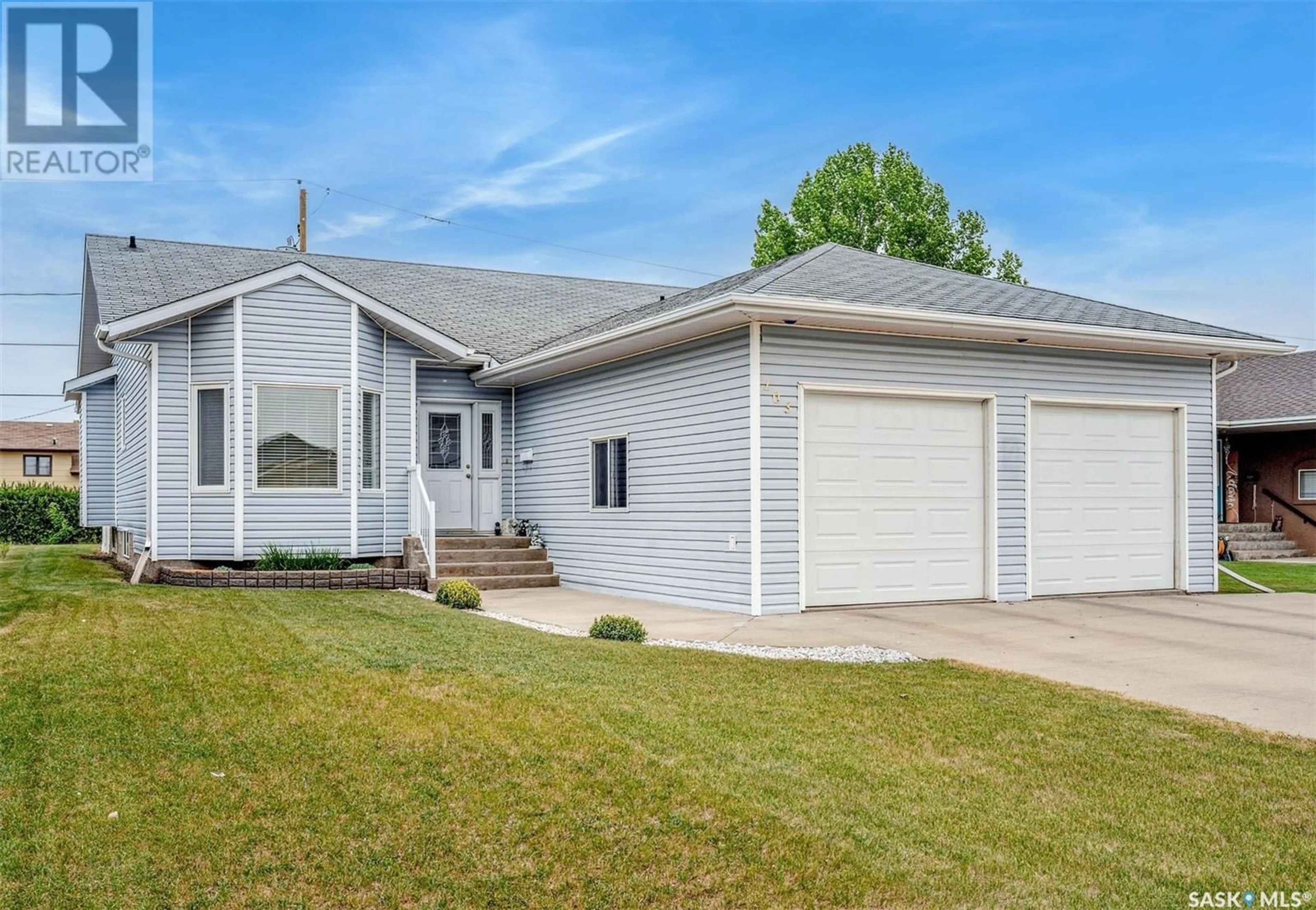 Home with vinyl exterior material, street for 103 LASKIN CRESCENT, Humboldt Saskatchewan S0K2A0