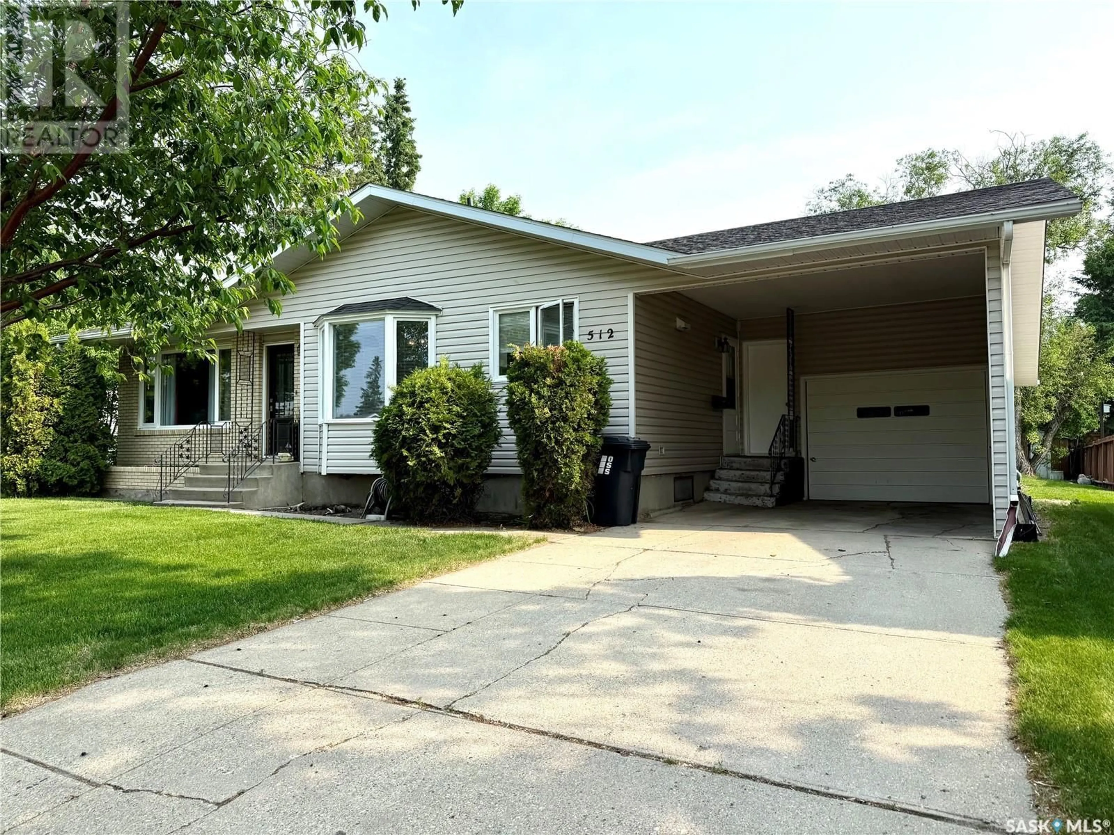 Home with vinyl exterior material, street for 512 RIVERVIEW ROAD, Yorkton Saskatchewan S3N2X9