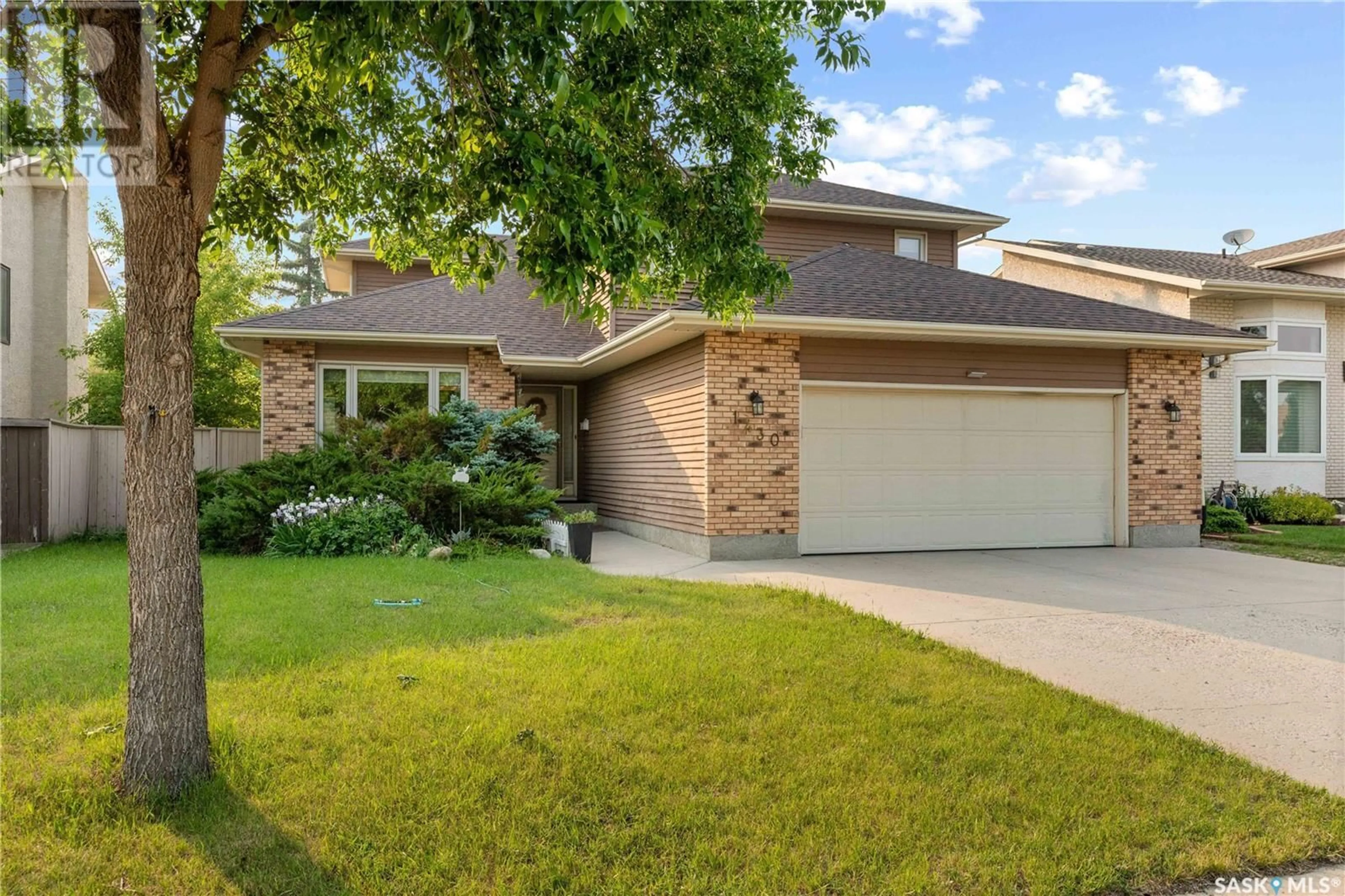 Home with brick exterior material, street for 1430 WASCANA HIGHLANDS, Regina Saskatchewan S4V2K2