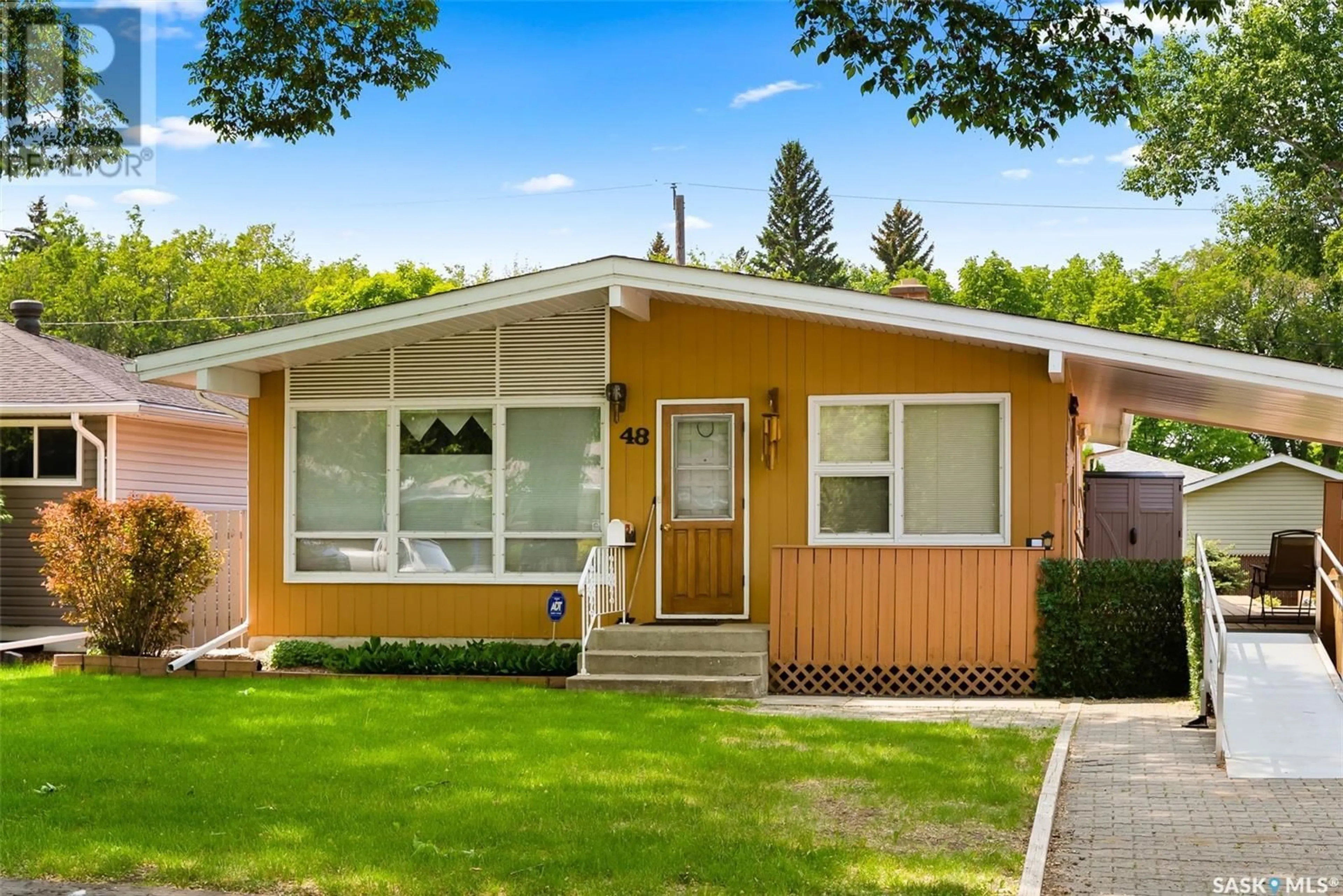 Home with vinyl exterior material, street for 48 MARSH CRESCENT, Regina Saskatchewan S4S5R5