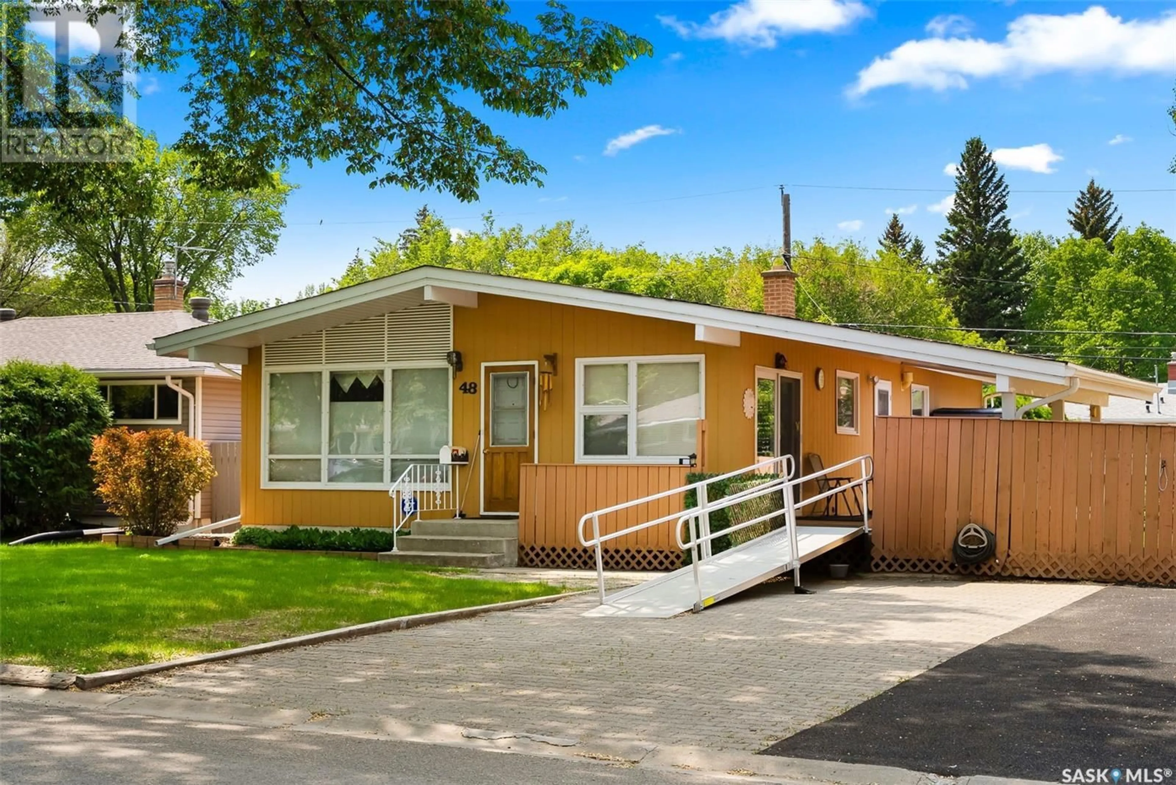 Home with vinyl exterior material, street for 48 MARSH CRESCENT, Regina Saskatchewan S4S5R5