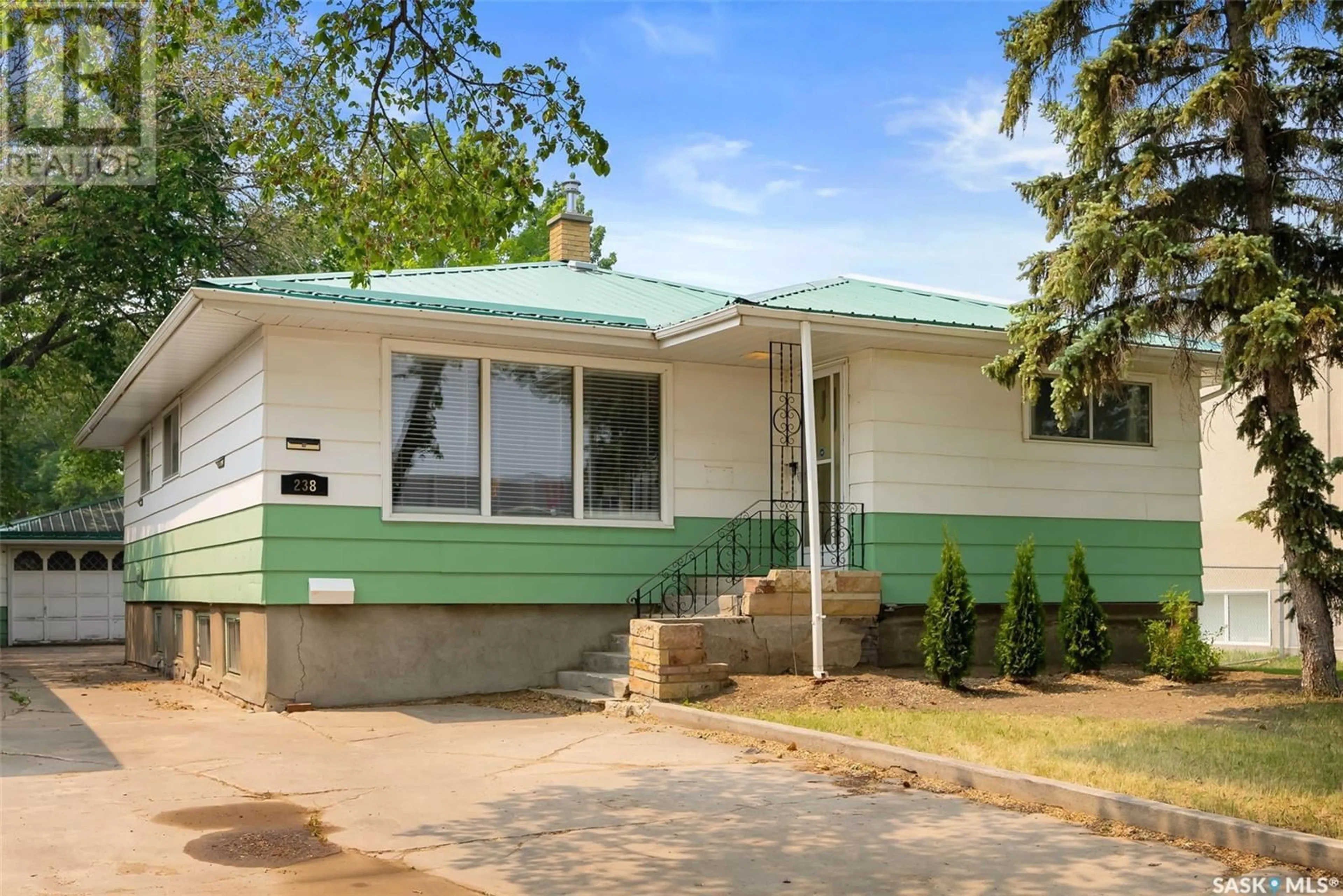 Home with vinyl exterior material, street for 238 HAMILTON STREET, Regina Saskatchewan S4R2A4