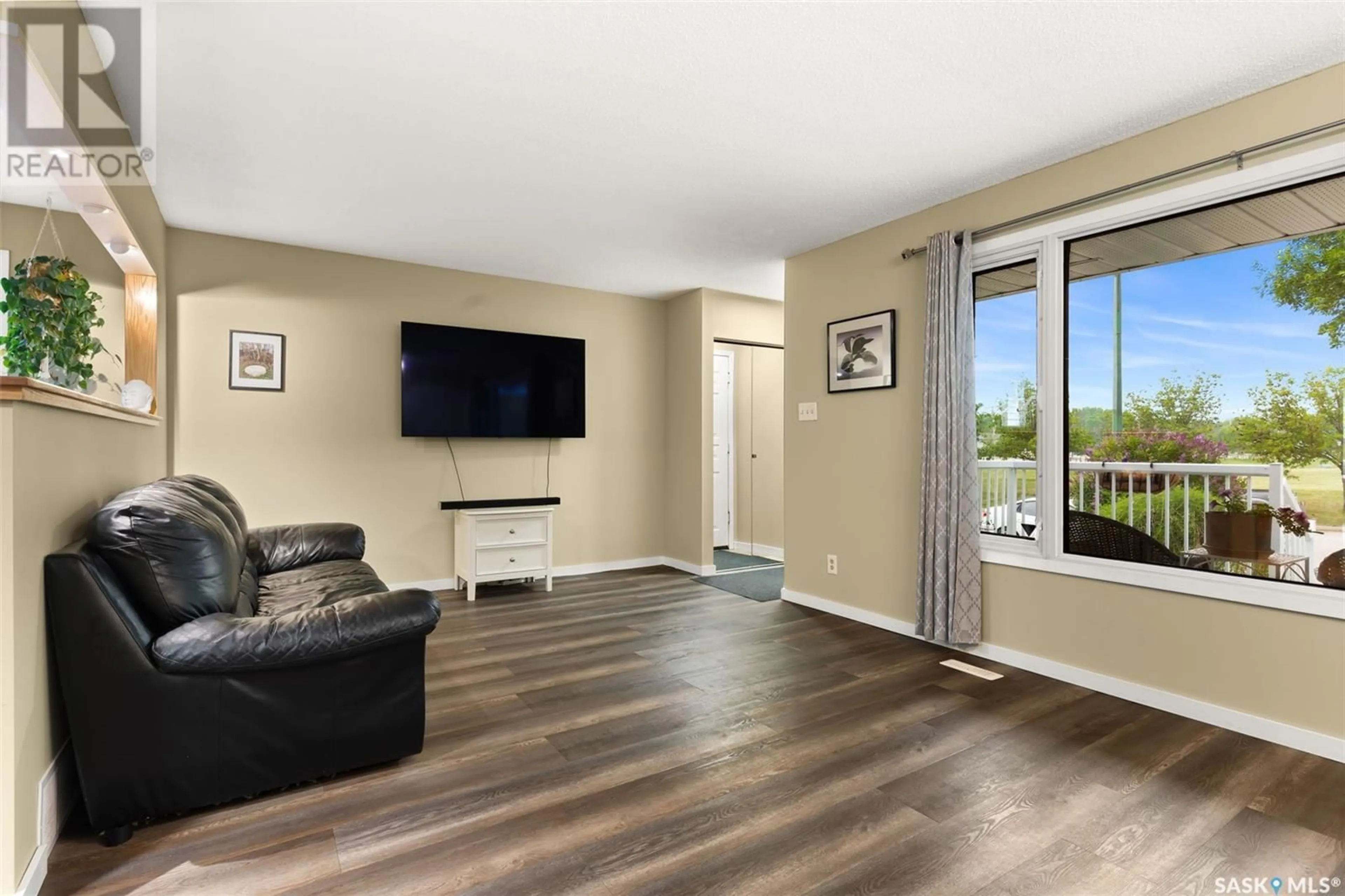Living room with furniture, wood/laminate floor for 1335 KENT STREET, Regina Saskatchewan S4T5T2