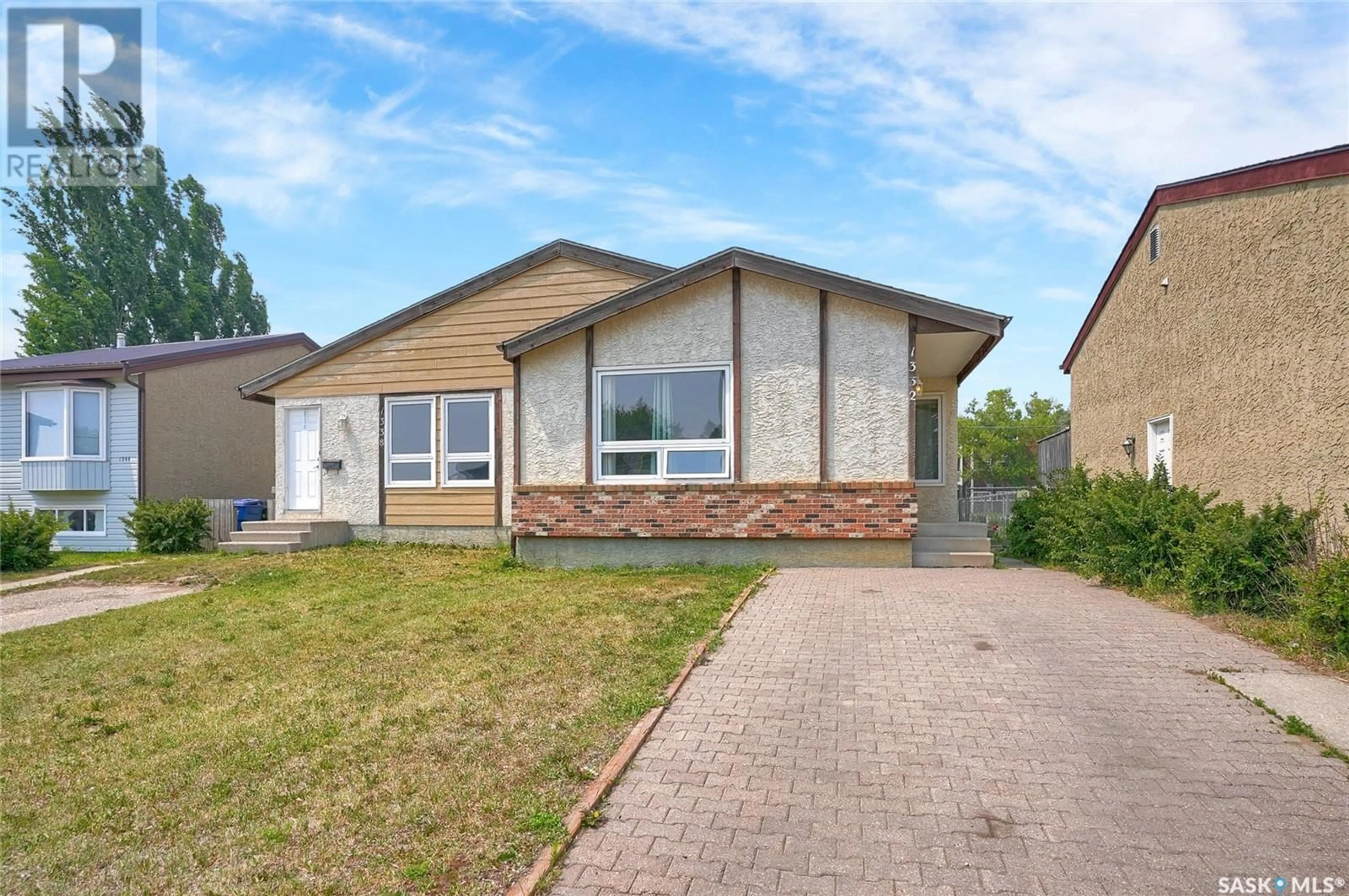 Home with vinyl exterior material, street for 1332-1338 IRVING AVENUE, Moose Jaw Saskatchewan S6H7N2
