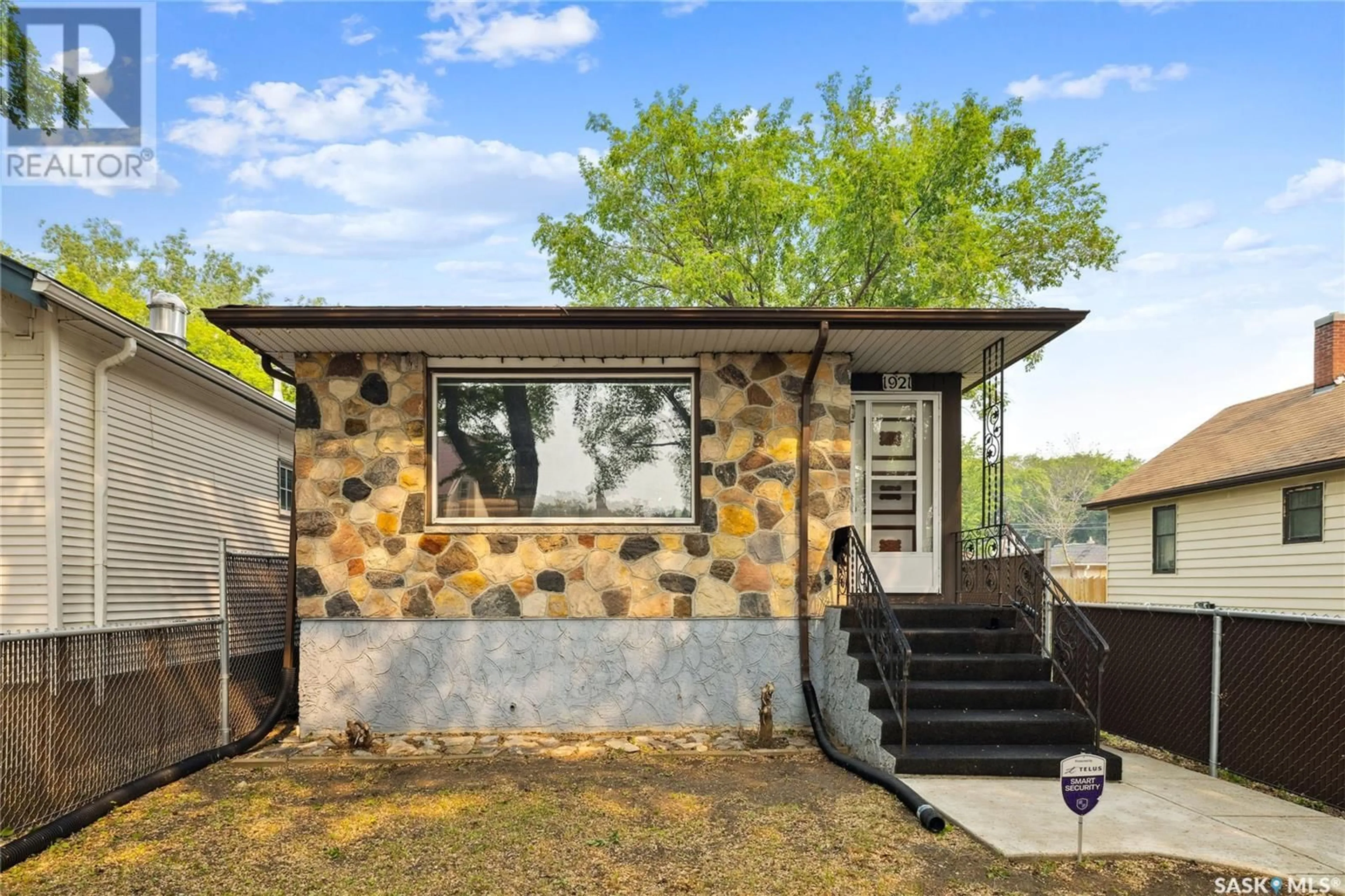 Home with vinyl exterior material, street for 1921 TORONTO STREET, Regina Saskatchewan S4P1M9