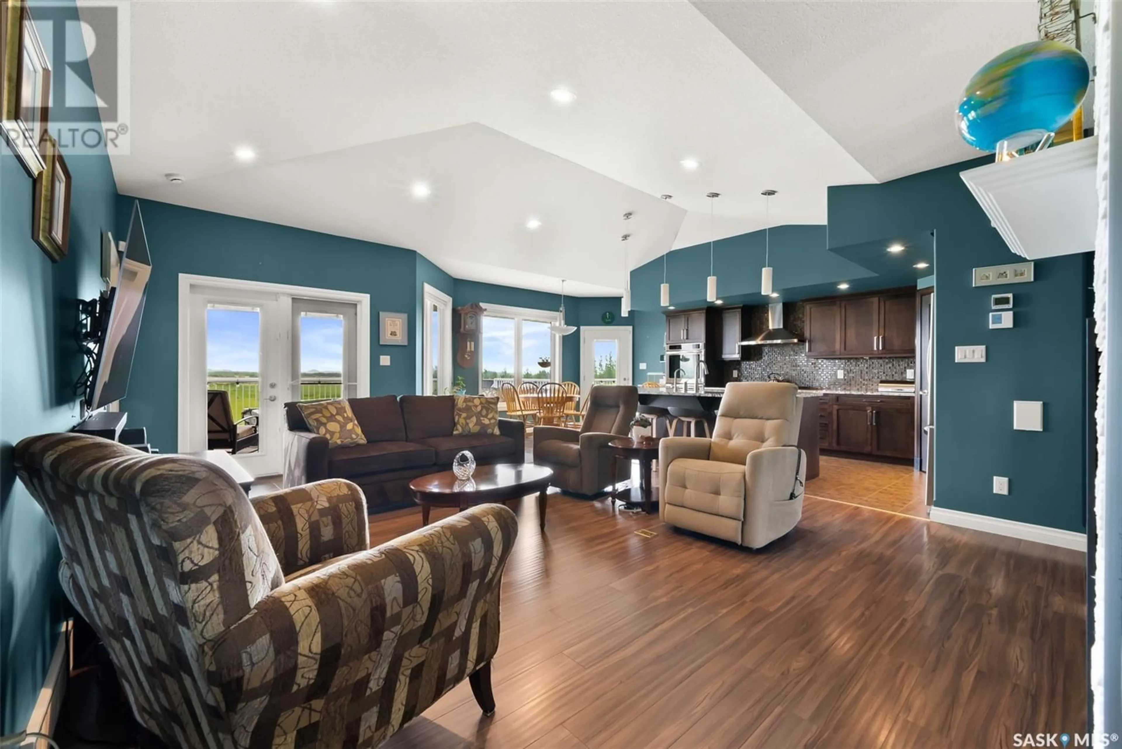Open concept kitchen, wood/laminate floor for 138 ROCK POINTE PLACE, Pilot Butte Saskatchewan S0G3Z0