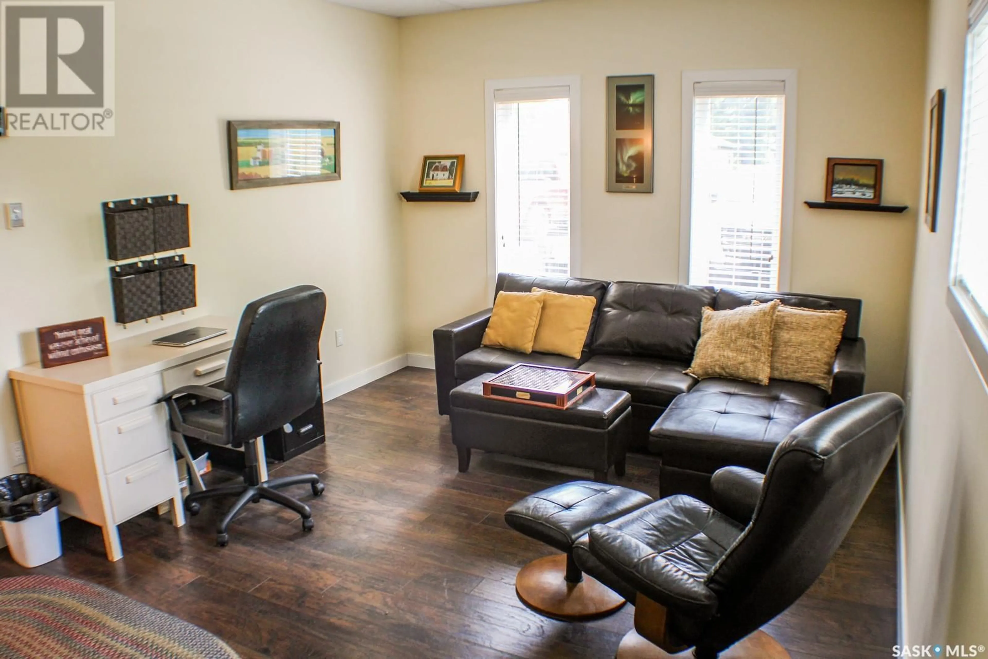 Living room with furniture, wood/laminate floor for 110 BAILLIE ROAD, Willow Creek Rm No. 458 Saskatchewan S0E0T0