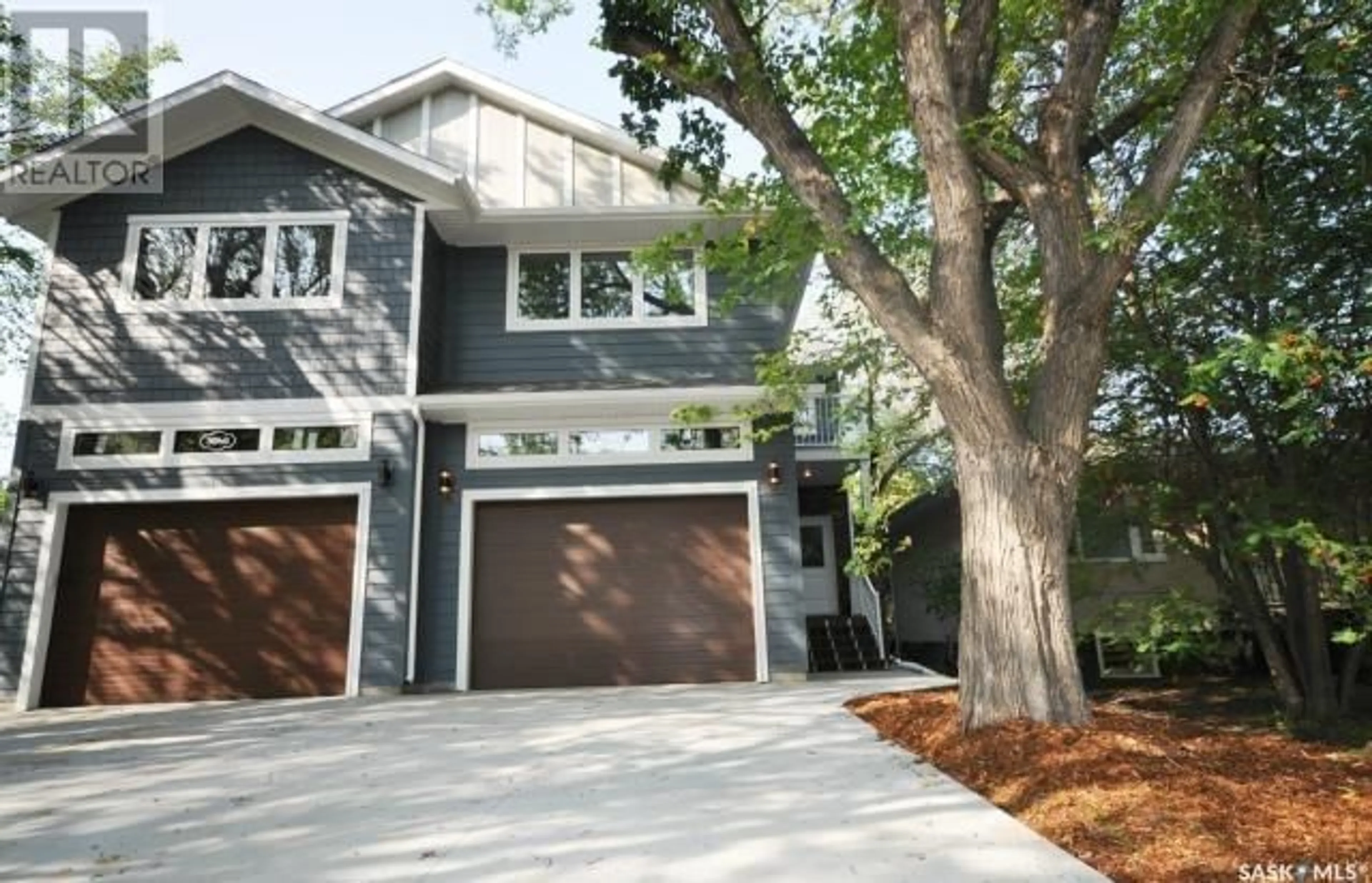 Home with vinyl exterior material, street for 304A 111TH STREET, Saskatoon Saskatchewan S7N1T3