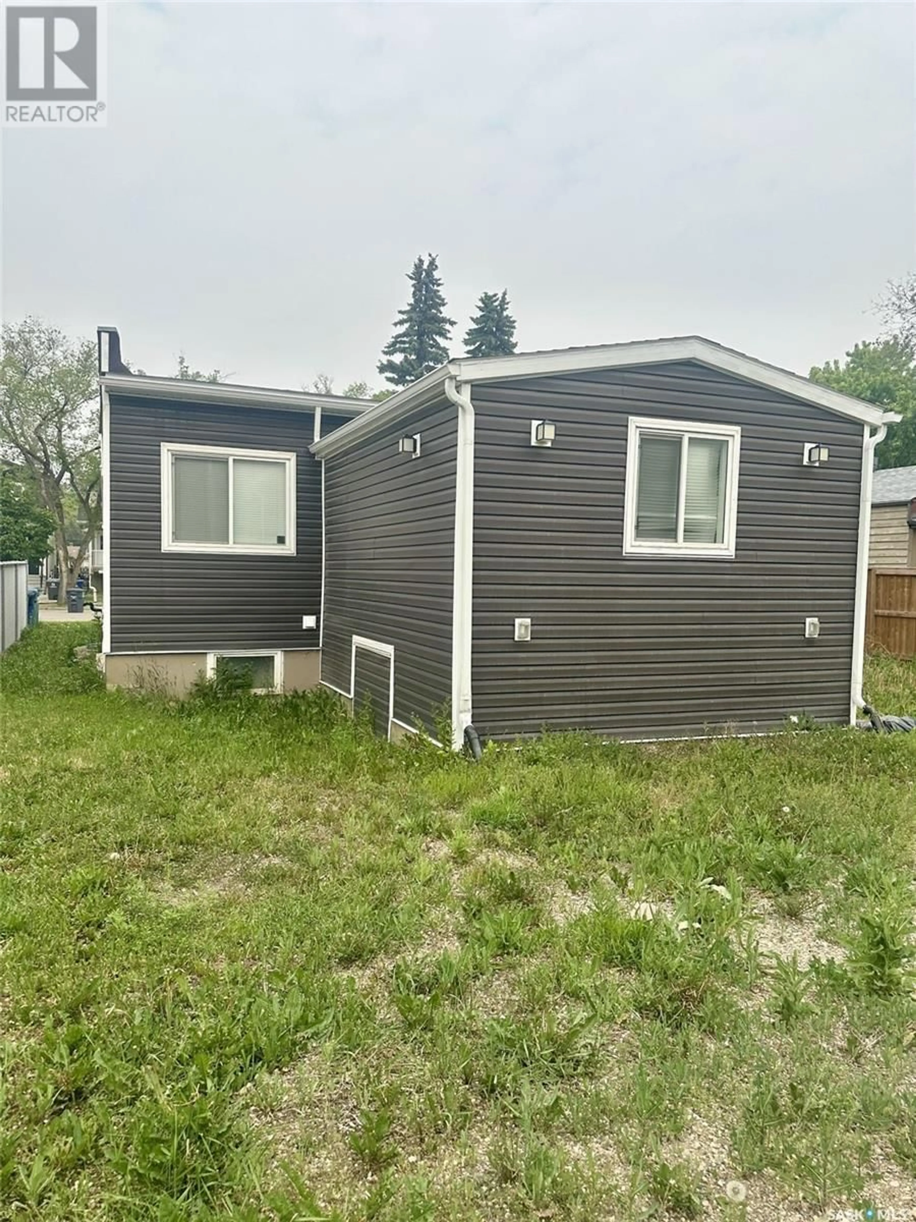 Home with vinyl exterior material, street for 413 109TH STREET, Saskatoon Saskatchewan S7N1R8