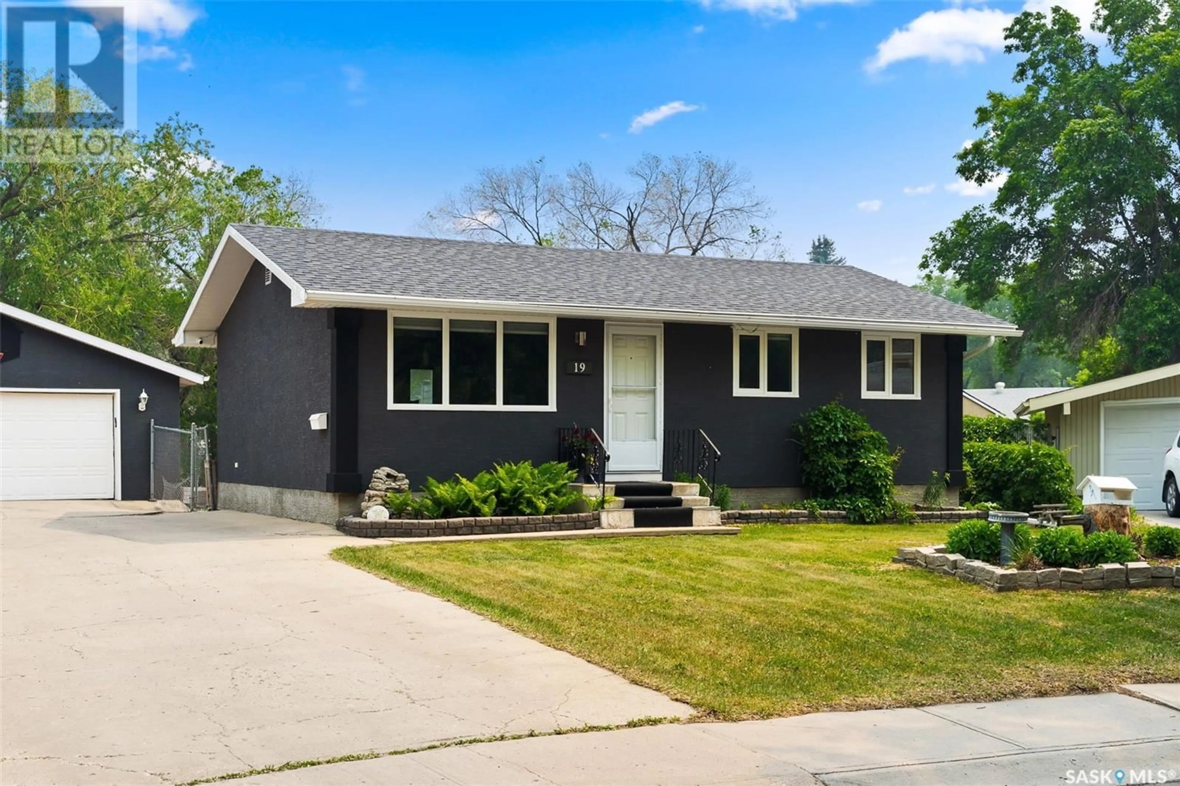 Home with vinyl exterior material, street for 19 LE JEUNE PLACE, Regina Saskatchewan S4T6K2