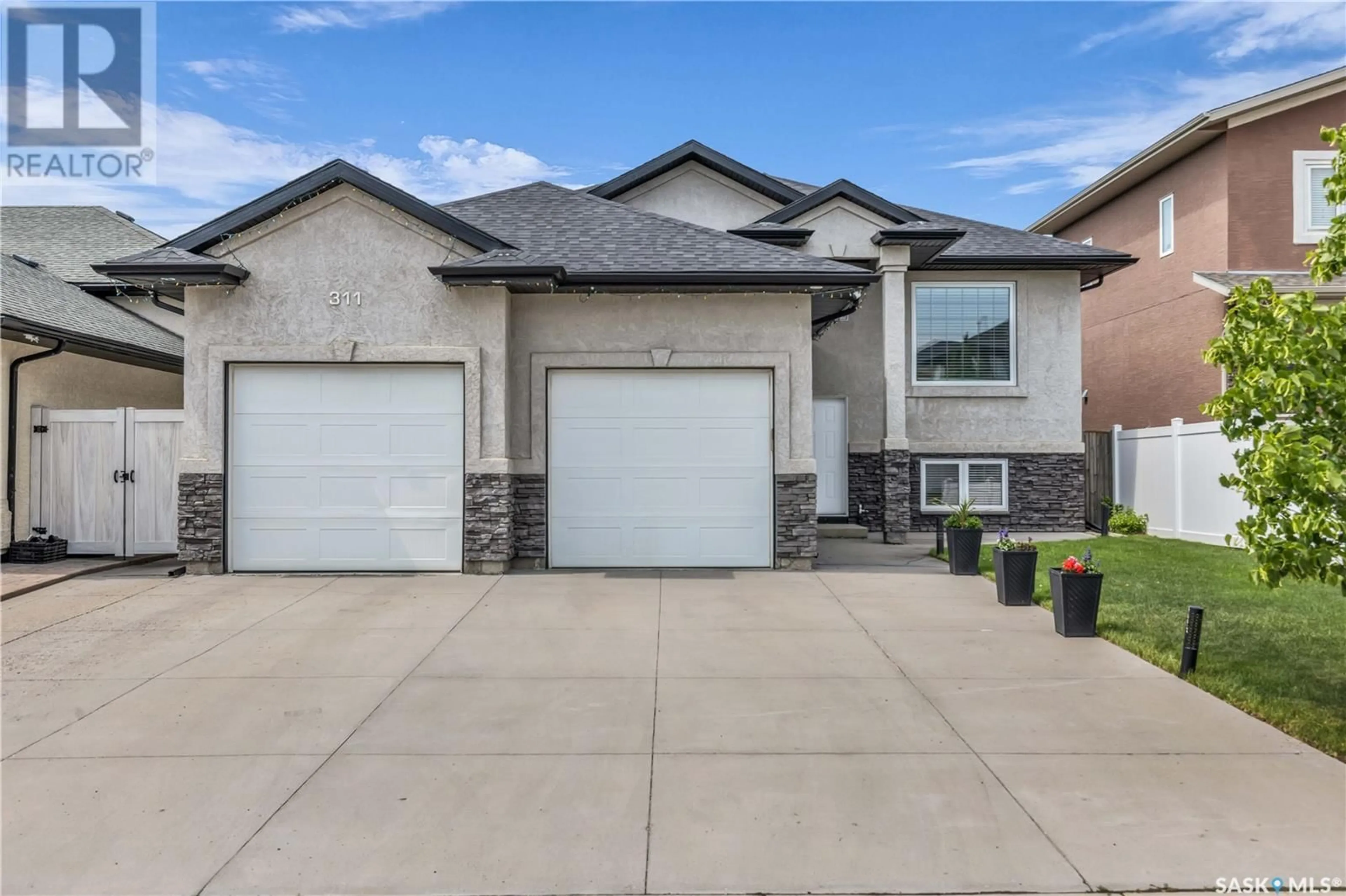 Home with brick exterior material, street for 311 WATERS CRESCENT, Saskatoon Saskatchewan S7W0A5