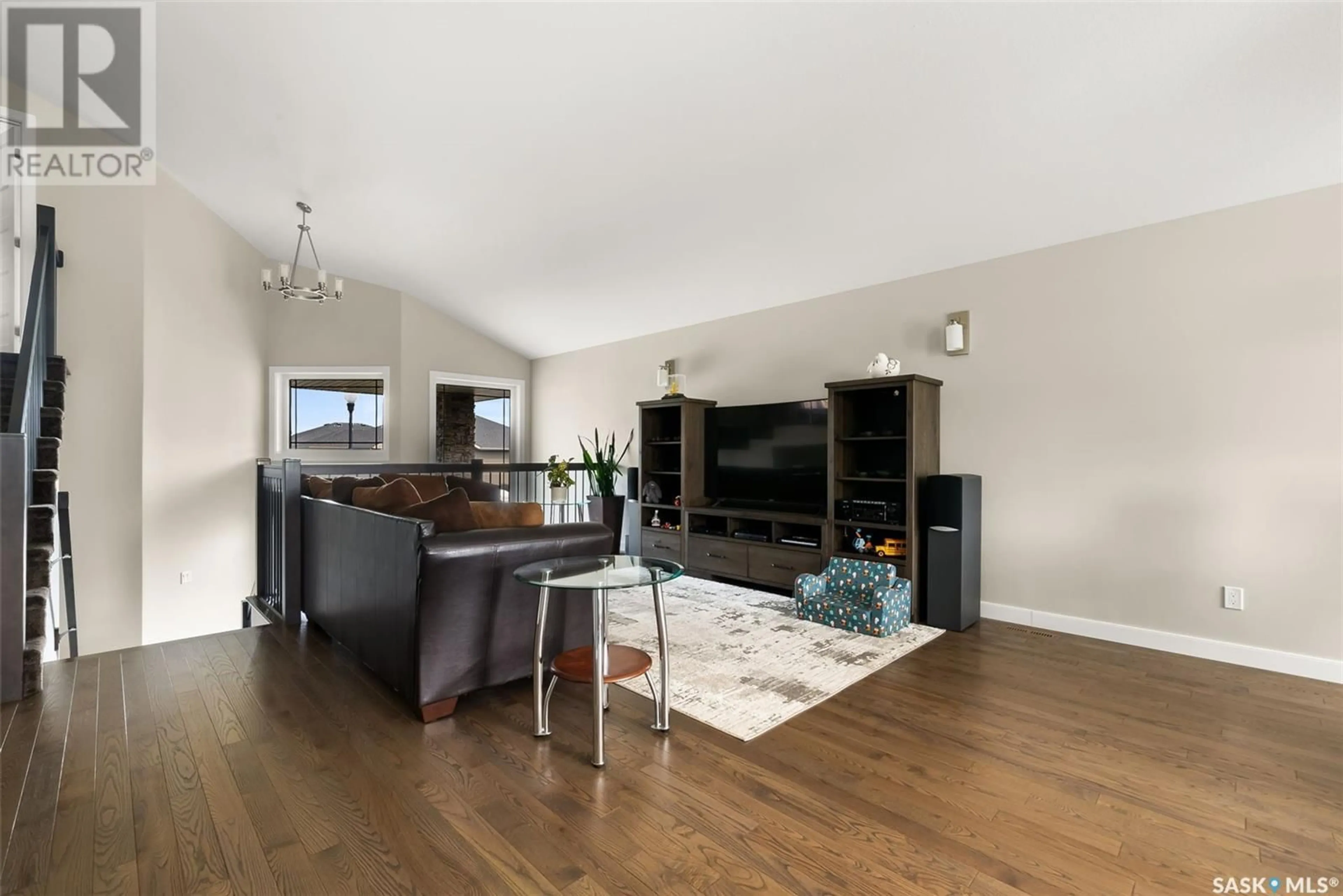 Living room with furniture, wood/laminate floor for 3945 SANDHILL CRESCENT, Regina Saskatchewan S4V3G7