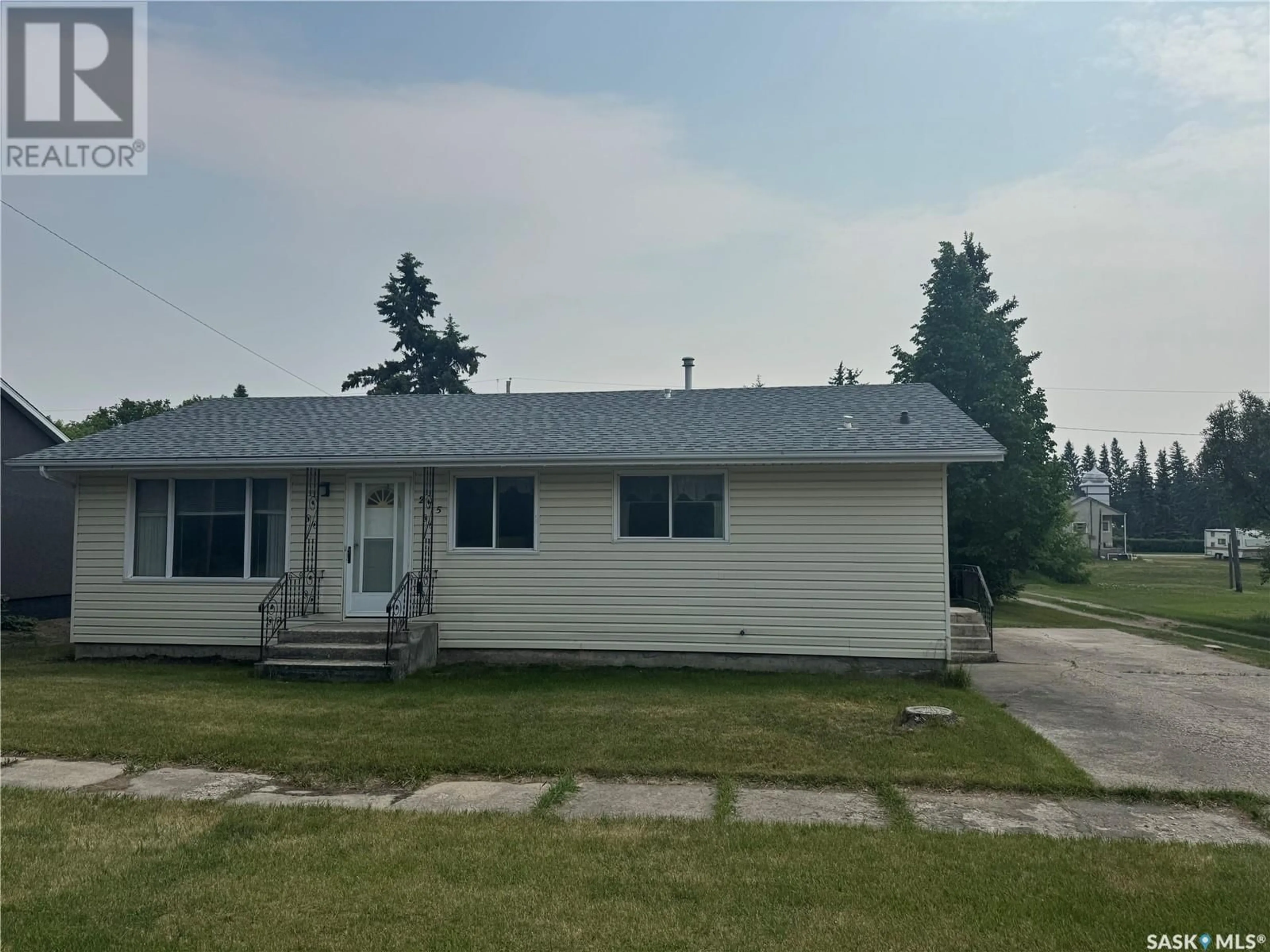 Home with vinyl exterior material, street for 215 1ST AVENUE, Hafford Saskatchewan S0J1A0