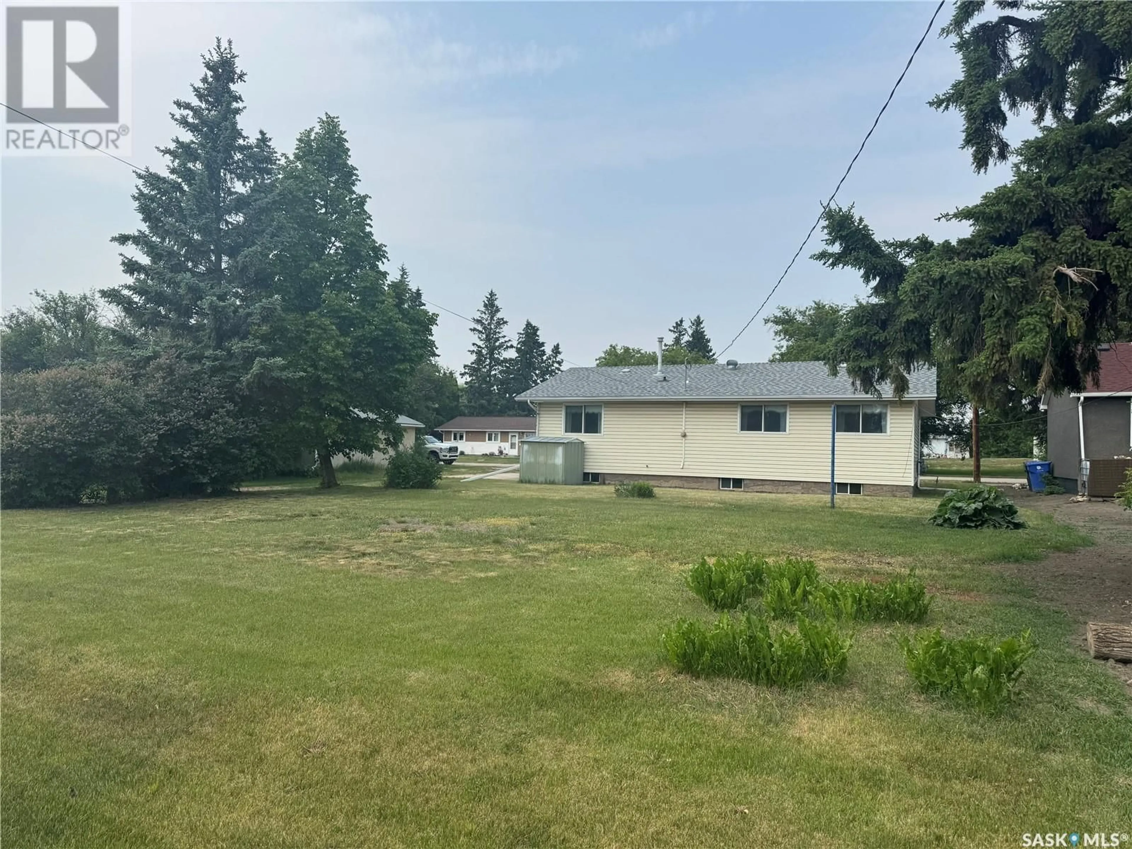 A pic from outside/outdoor area/front of a property/back of a property/a pic from drone, unknown for 215 1ST AVENUE, Hafford Saskatchewan S0J1A0