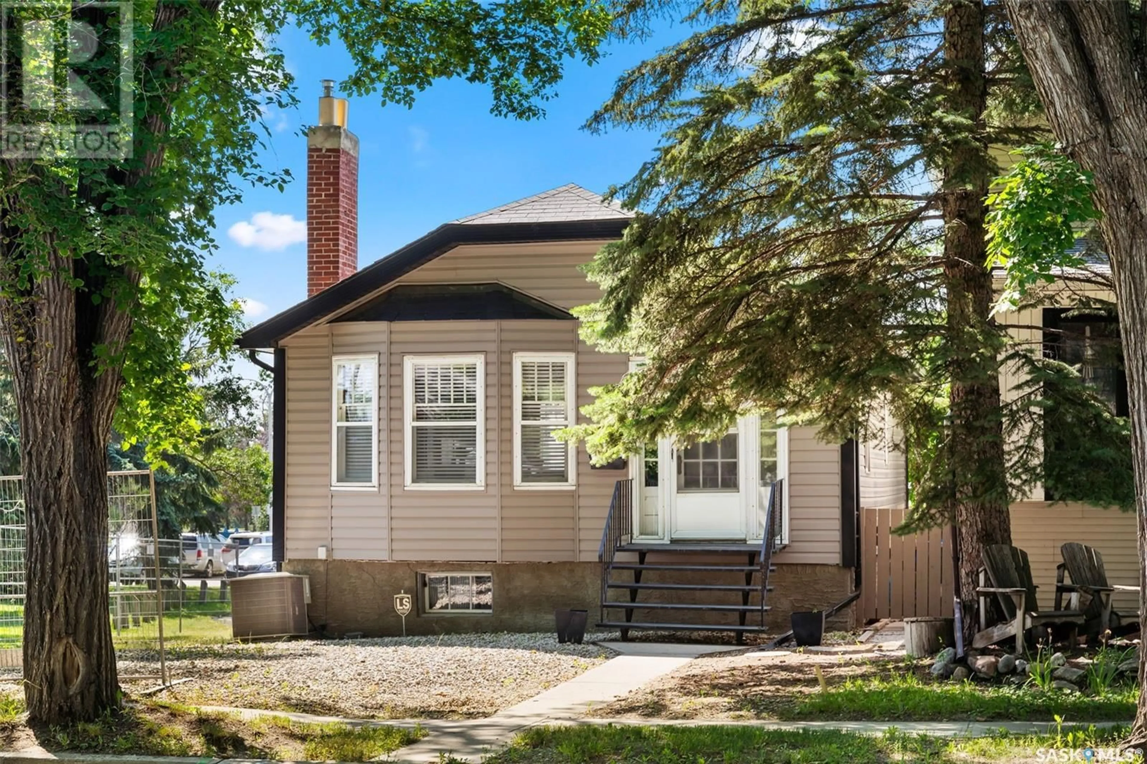 Home with brick exterior material, street for 2366 ELPHINSTONE STREET, Regina Saskatchewan S4S0J7