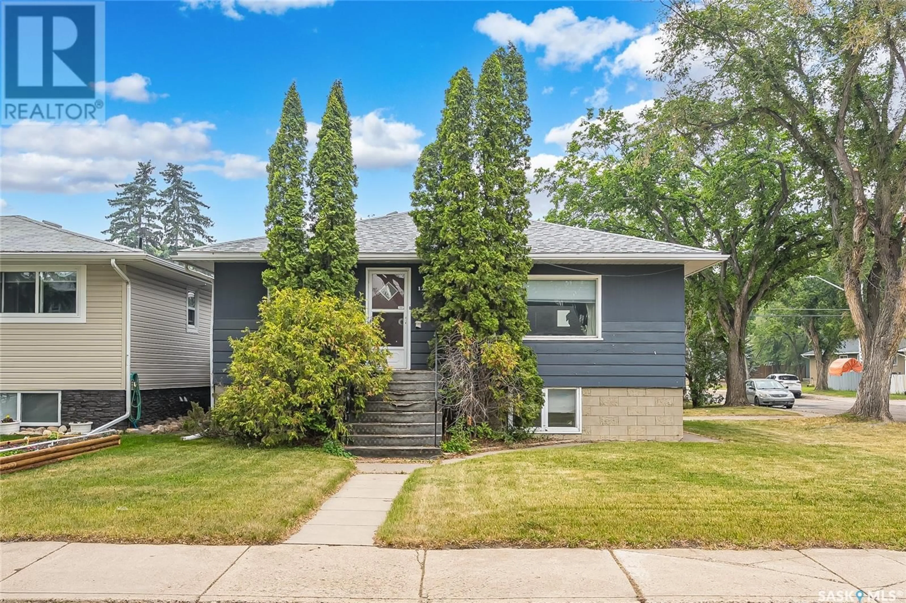 Home with vinyl exterior material, street for 1201 M AVENUE, Saskatoon Saskatchewan S7M2M3