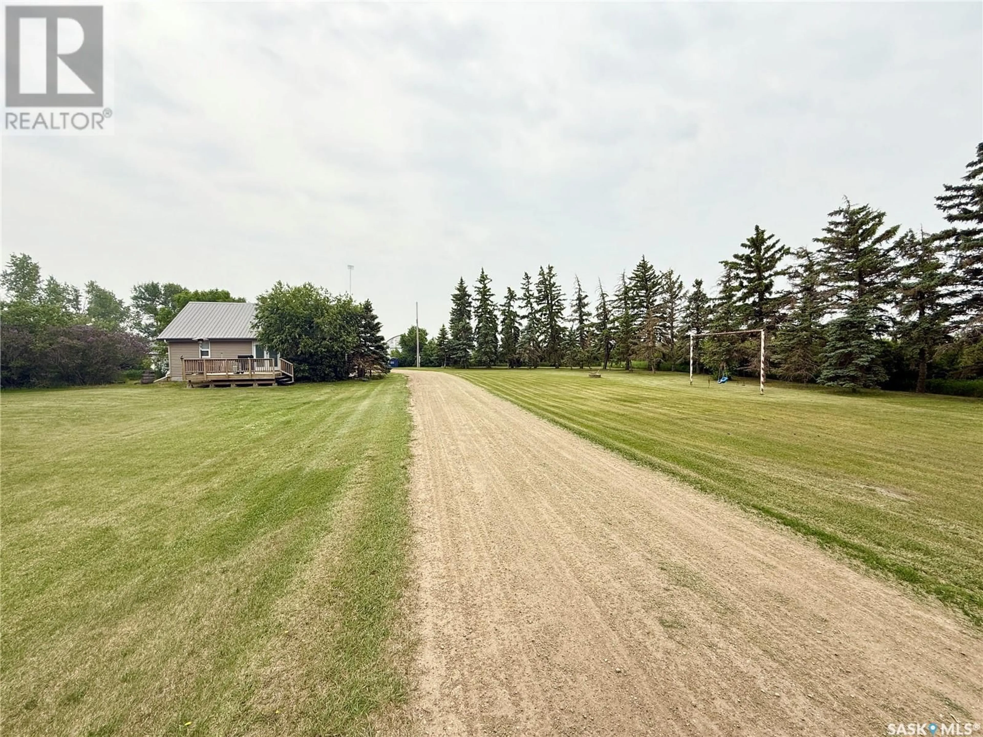 A pic from outside/outdoor area/front of a property/back of a property/a pic from drone, street for WEYBURN ACREAGE, Weyburn Rm No. 67 Saskatchewan S4H2K1