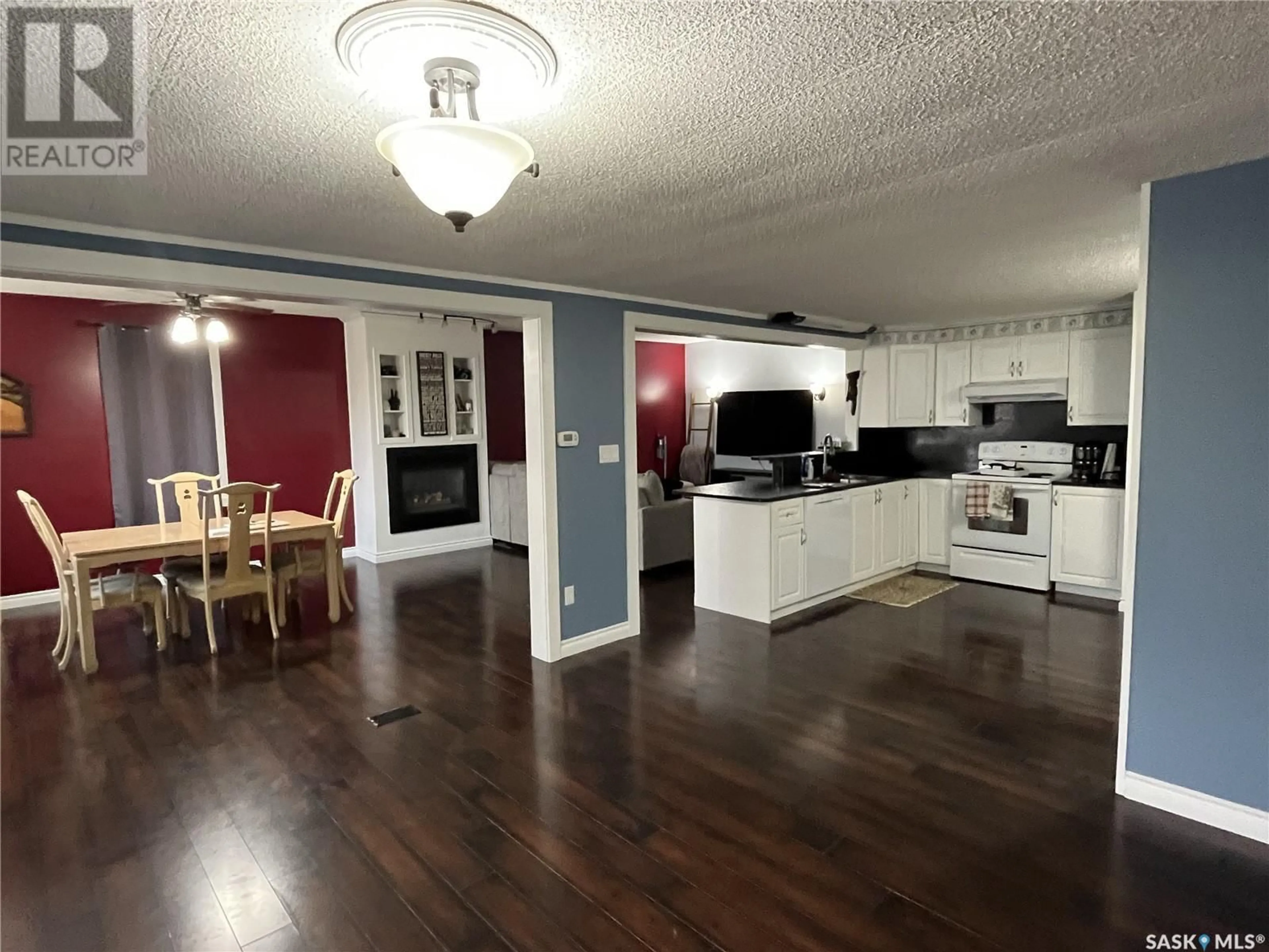Open concept kitchen, wood/laminate floor for 526 RUPERT CRESCENT, Codette Saskatchewan S0E0P0