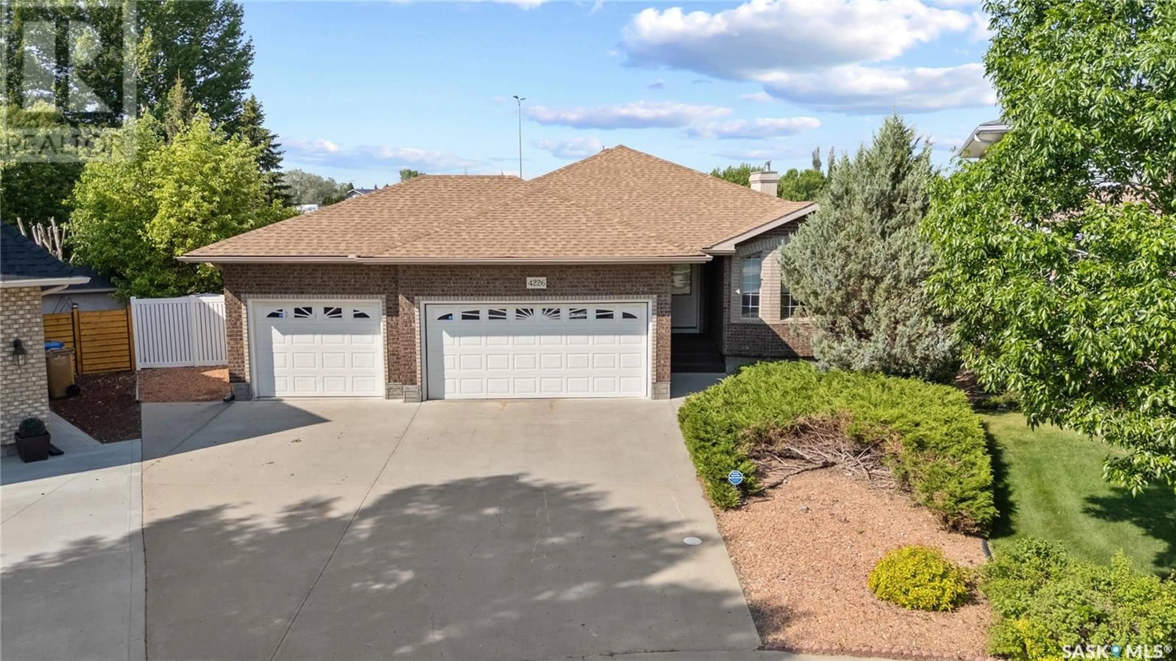 Home with brick exterior material, street for 4226 WASCANA RIDGE, Regina Saskatchewan S4V2T1