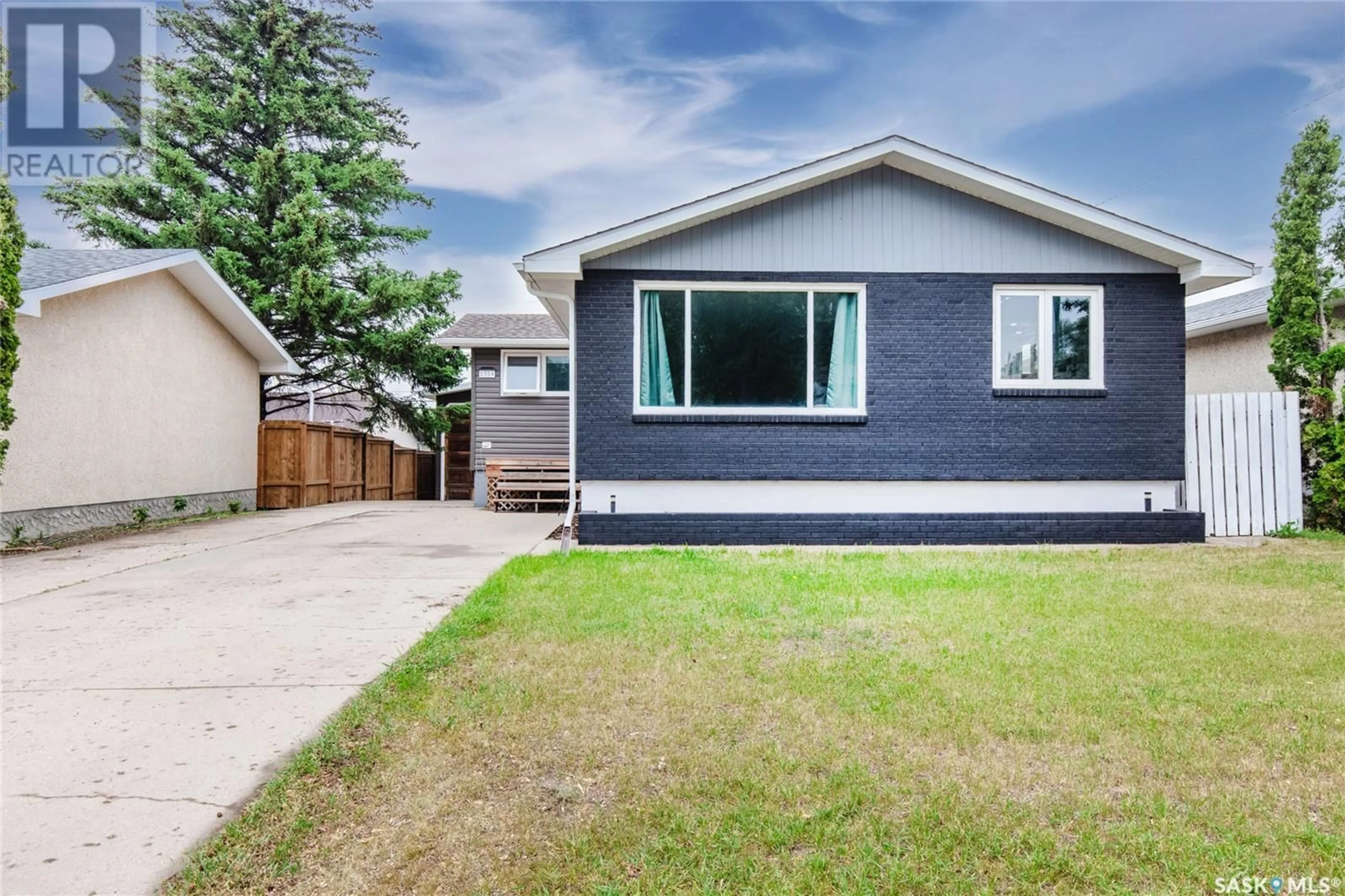 Home with vinyl exterior material, street for 1314 GRANDVIEW STREET, Moose Jaw Saskatchewan S6H6H8
