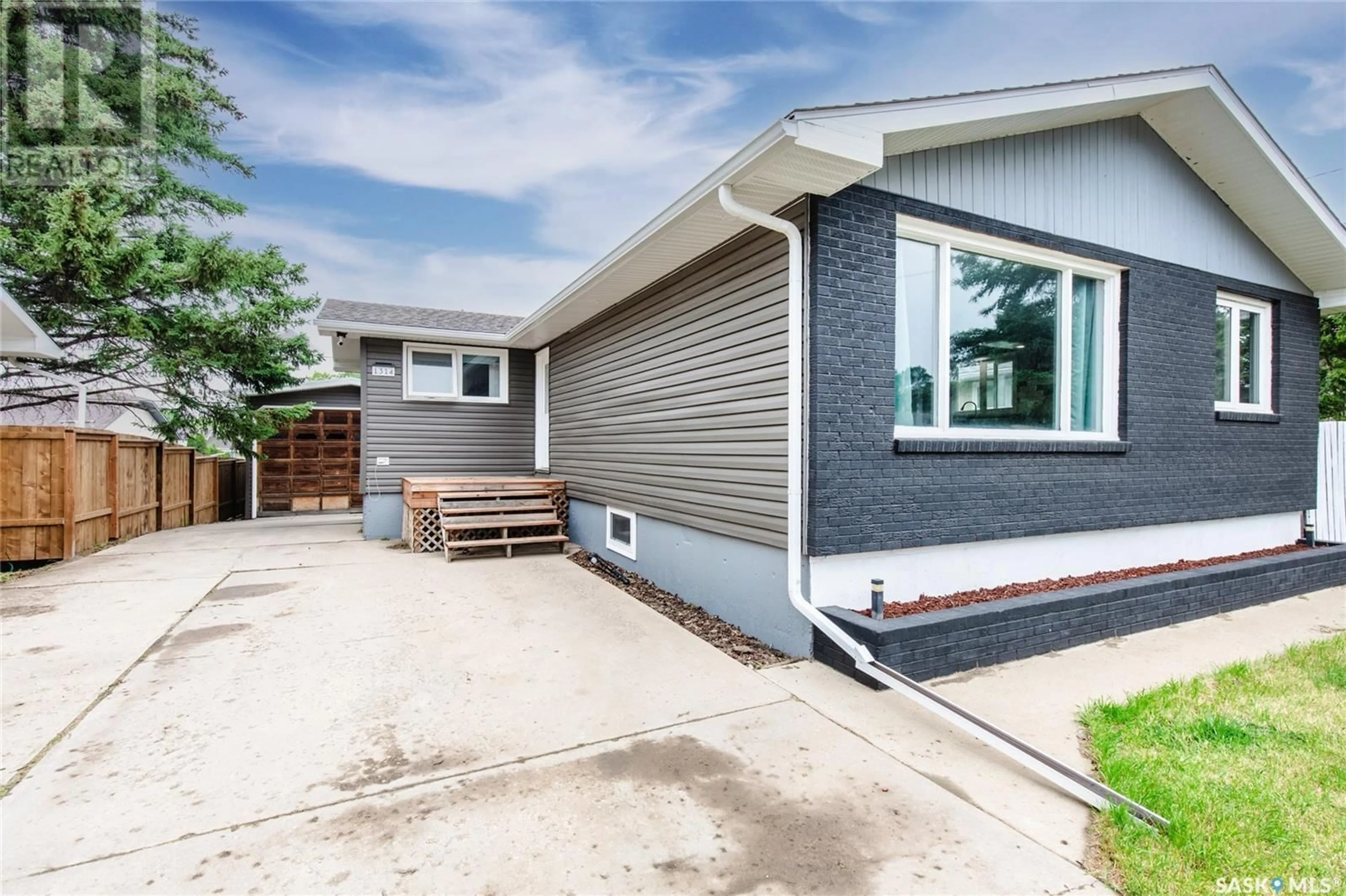 Home with vinyl exterior material, street for 1314 GRANDVIEW STREET, Moose Jaw Saskatchewan S6H6H8