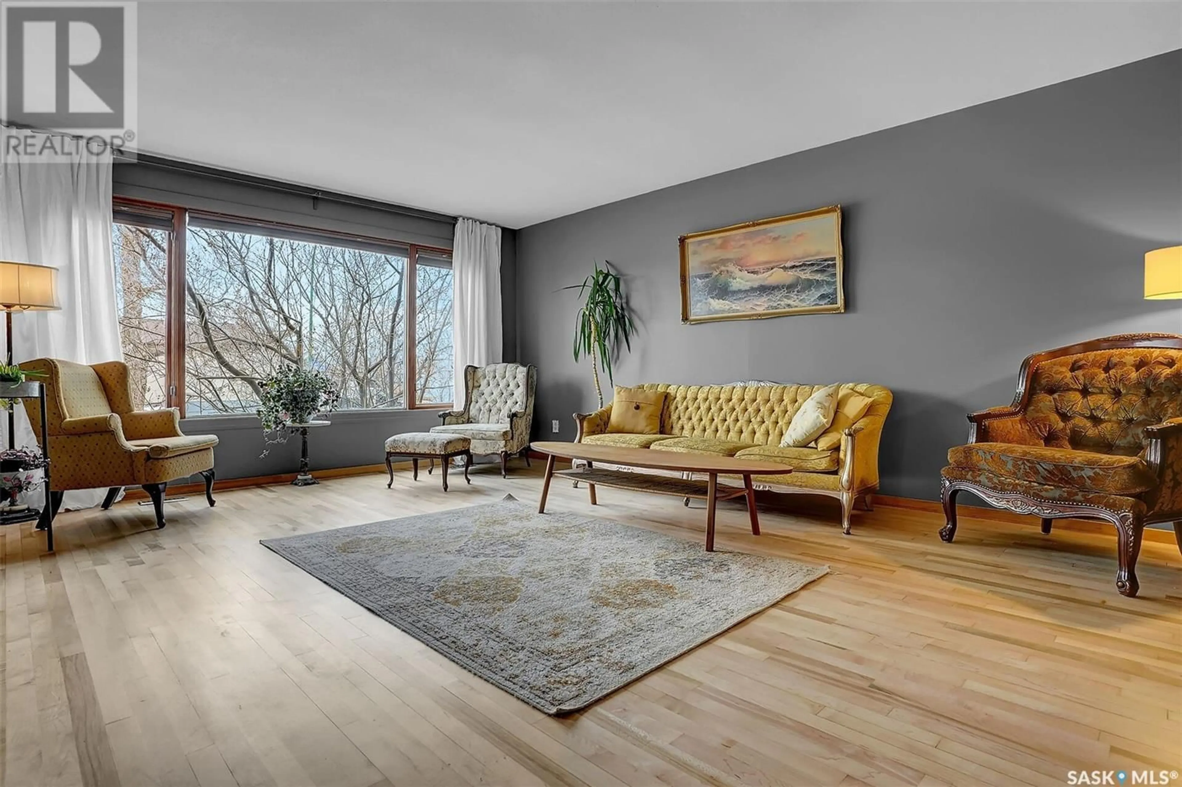 Living room with furniture, wood/laminate floor for 7210 WHELAN DRIVE, Regina Saskatchewan S4X3W7