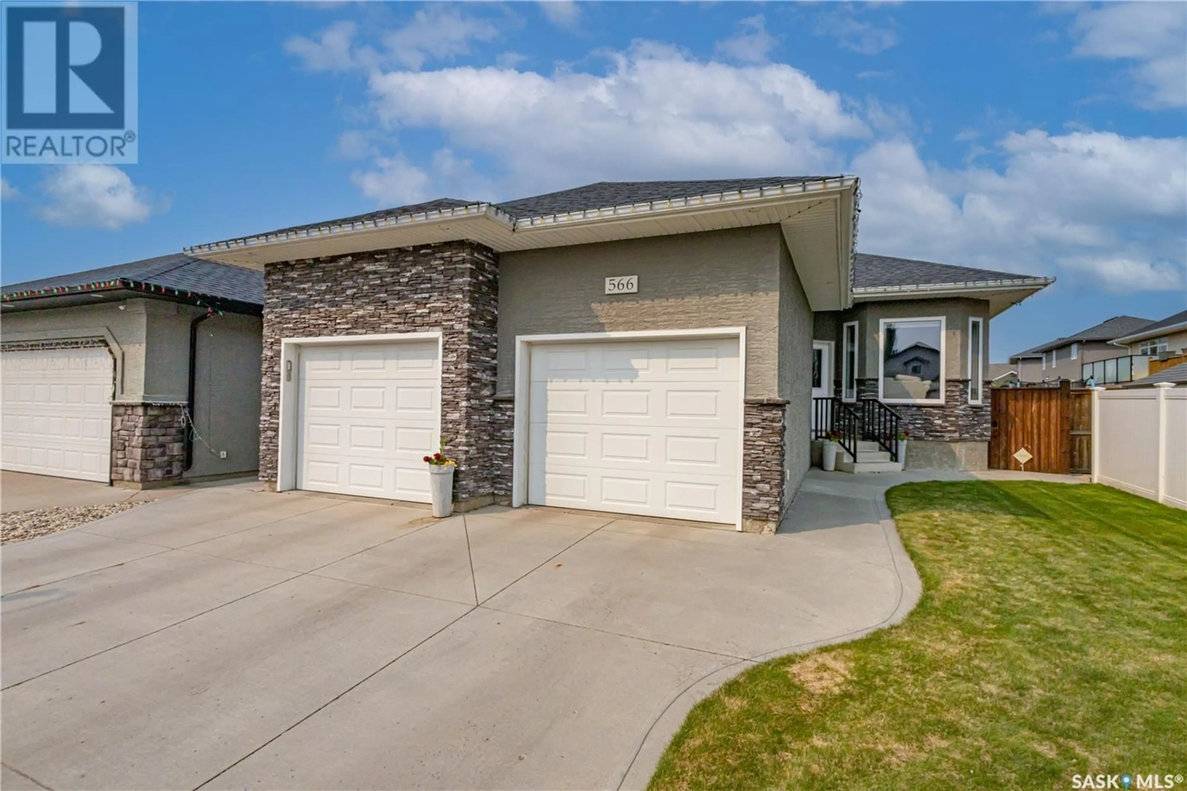 Home with brick exterior material, street for 566 REMPEL MANOR, Saskatoon Saskatchewan S7T0J4