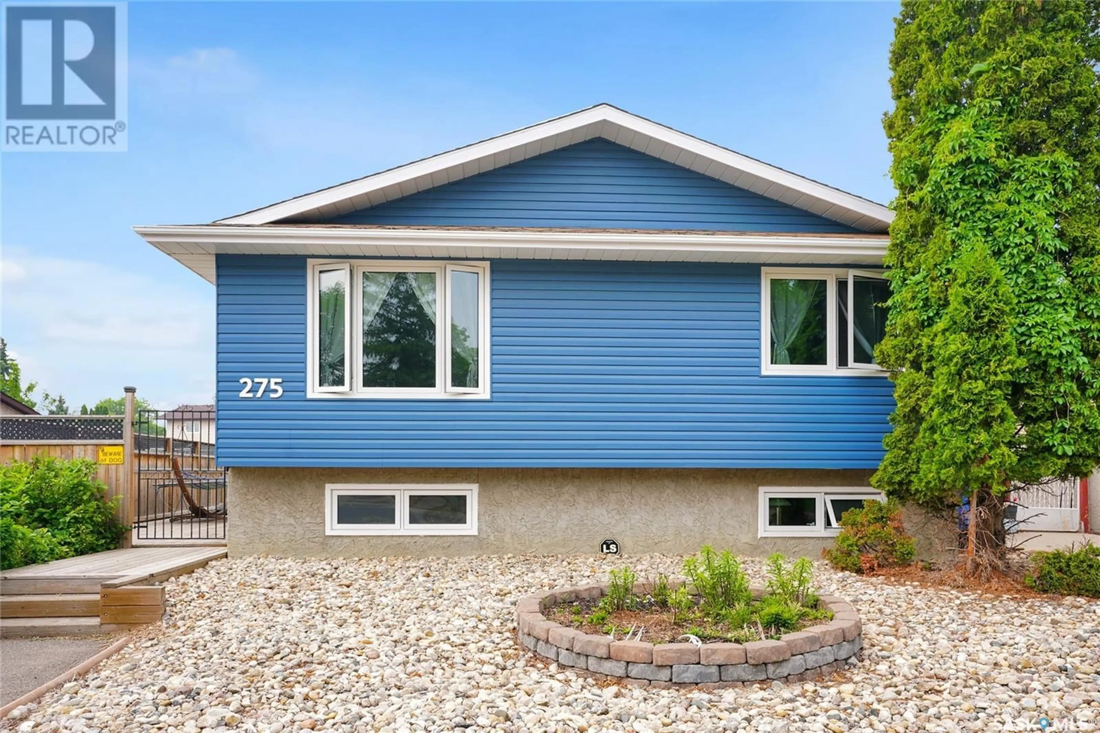 Home with vinyl exterior material, street for 275 FULTON DRIVE, Regina Saskatchewan S4X2N9
