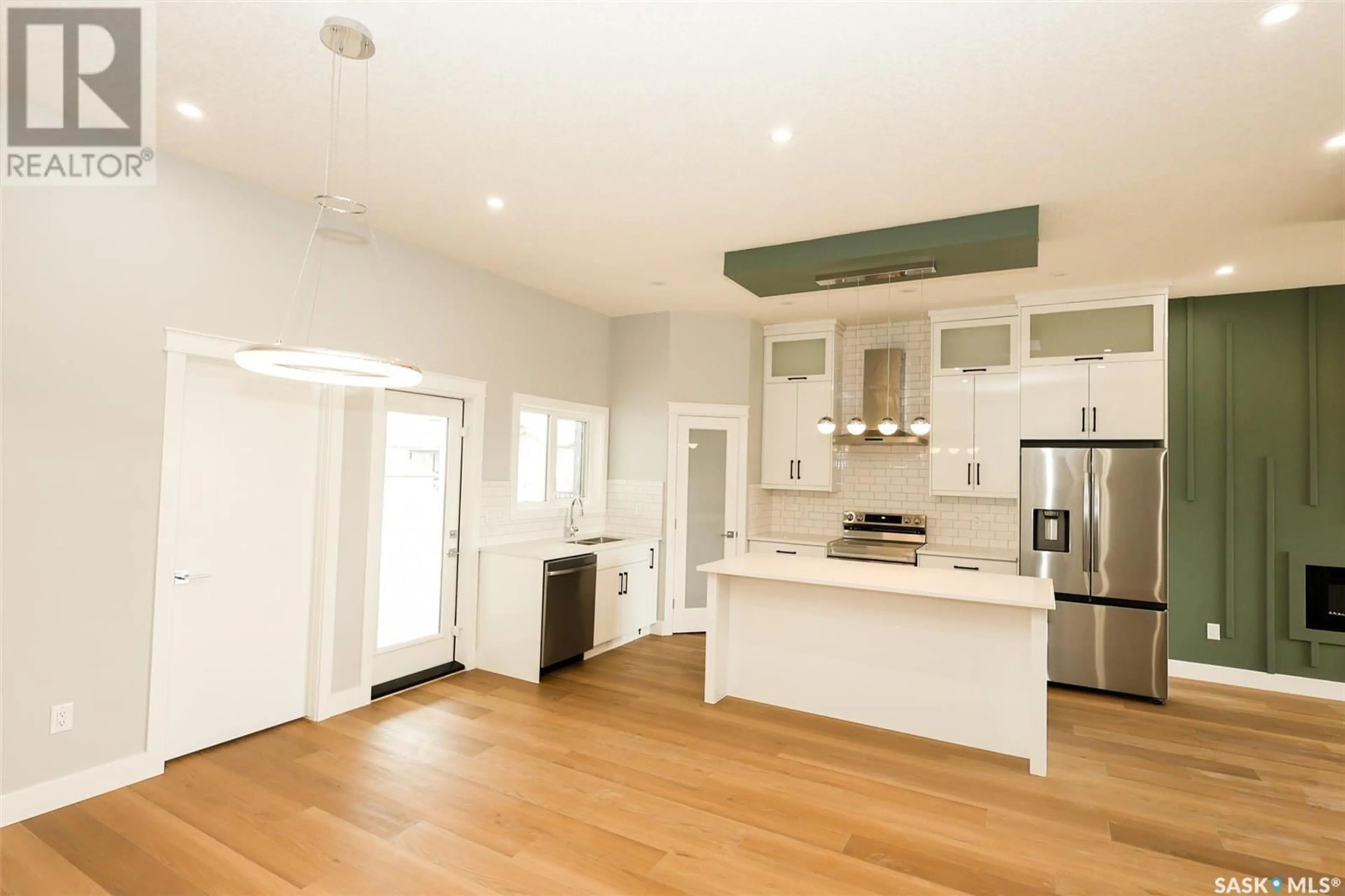 Open concept kitchen, wood/laminate floor for 171 MCARTHUR LANE, Saskatoon Saskatchewan S7L6Y3