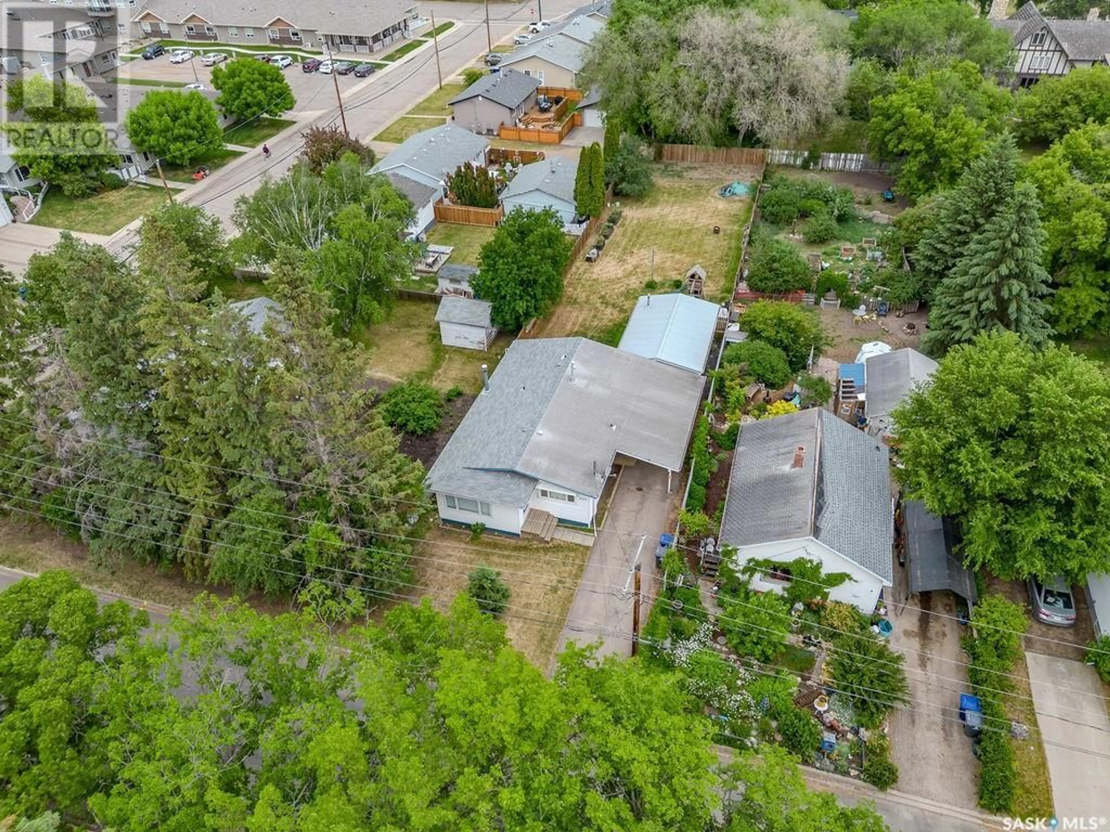 A pic from outside/outdoor area/front of a property/back of a property/a pic from drone, street for 605 5TH AVENUE, Rosthern Saskatchewan S0K3R0