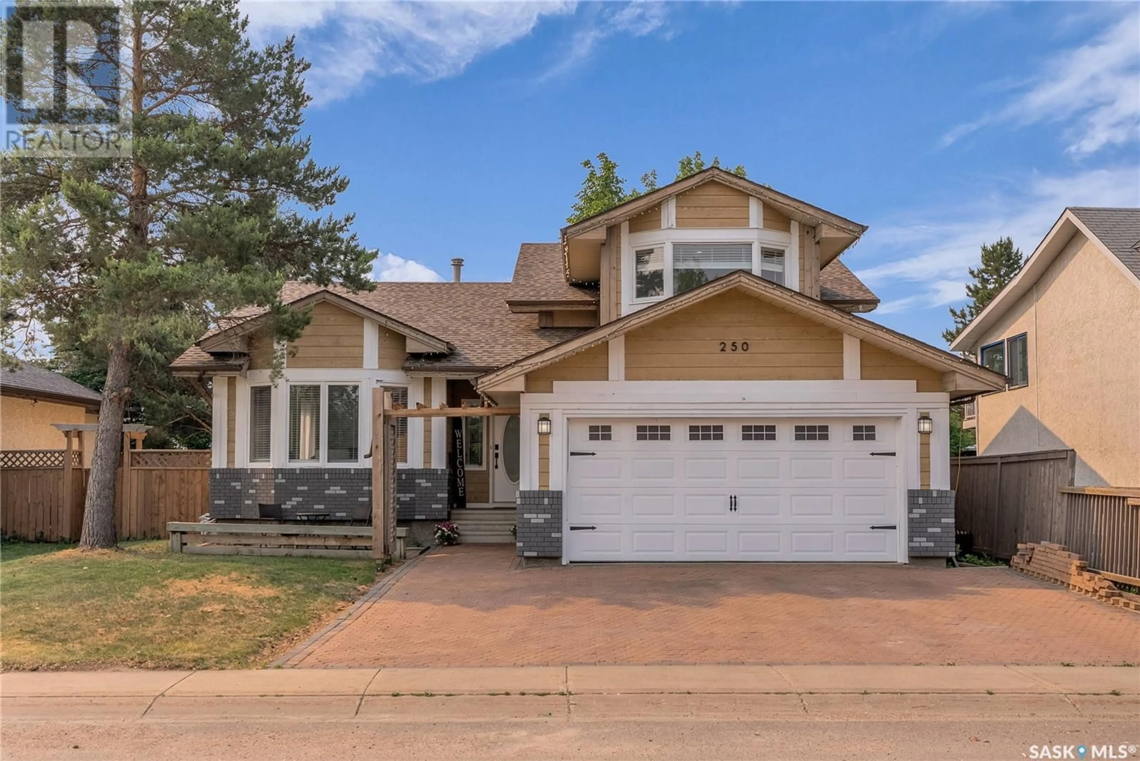 Home with brick exterior material, street for 250 EMMELINE ROAD, Saskatoon Saskatchewan S7J5B7