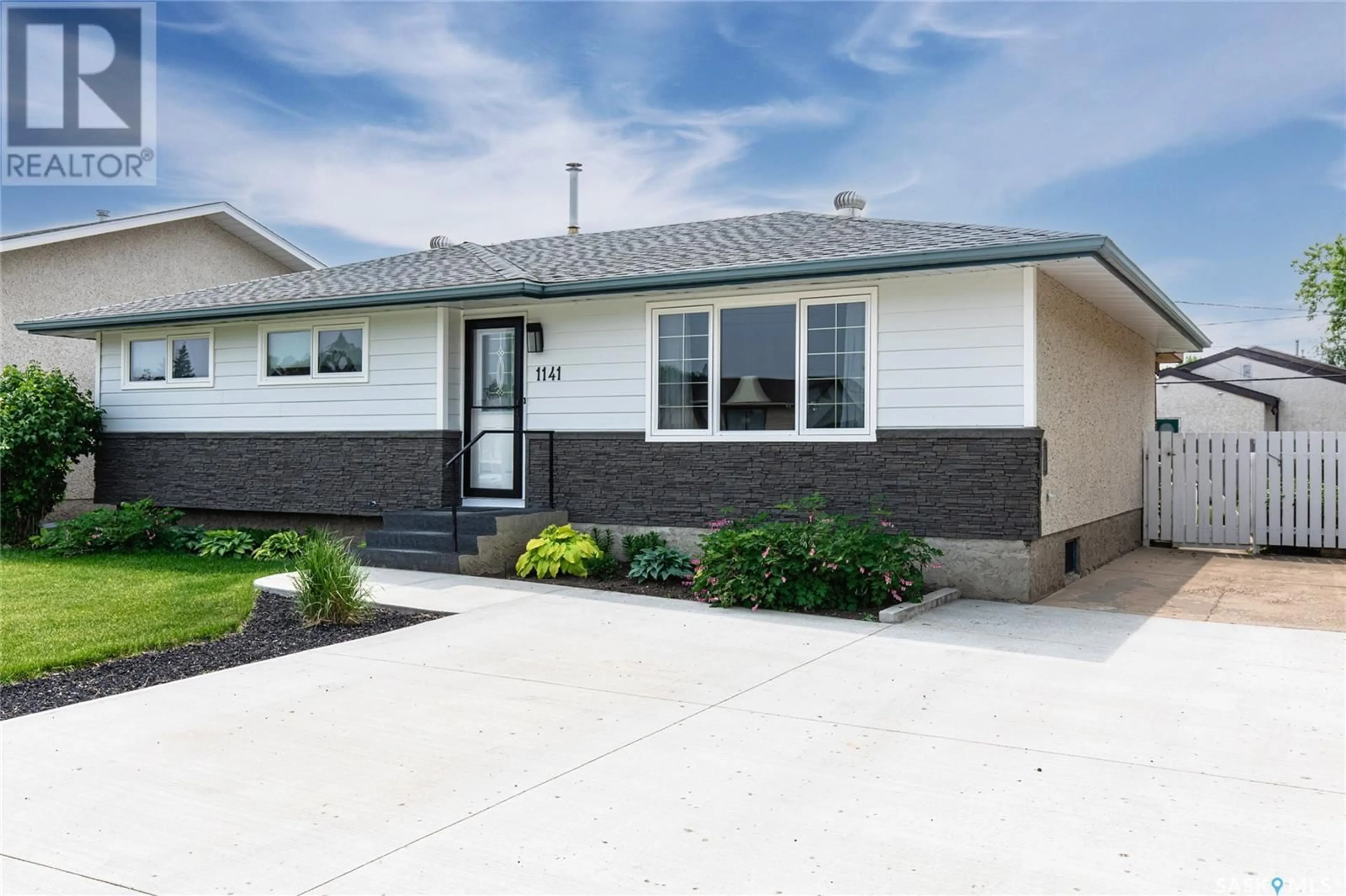 Home with vinyl exterior material, street for 1141 WARNER STREET, Moose Jaw Saskatchewan S6H6J8