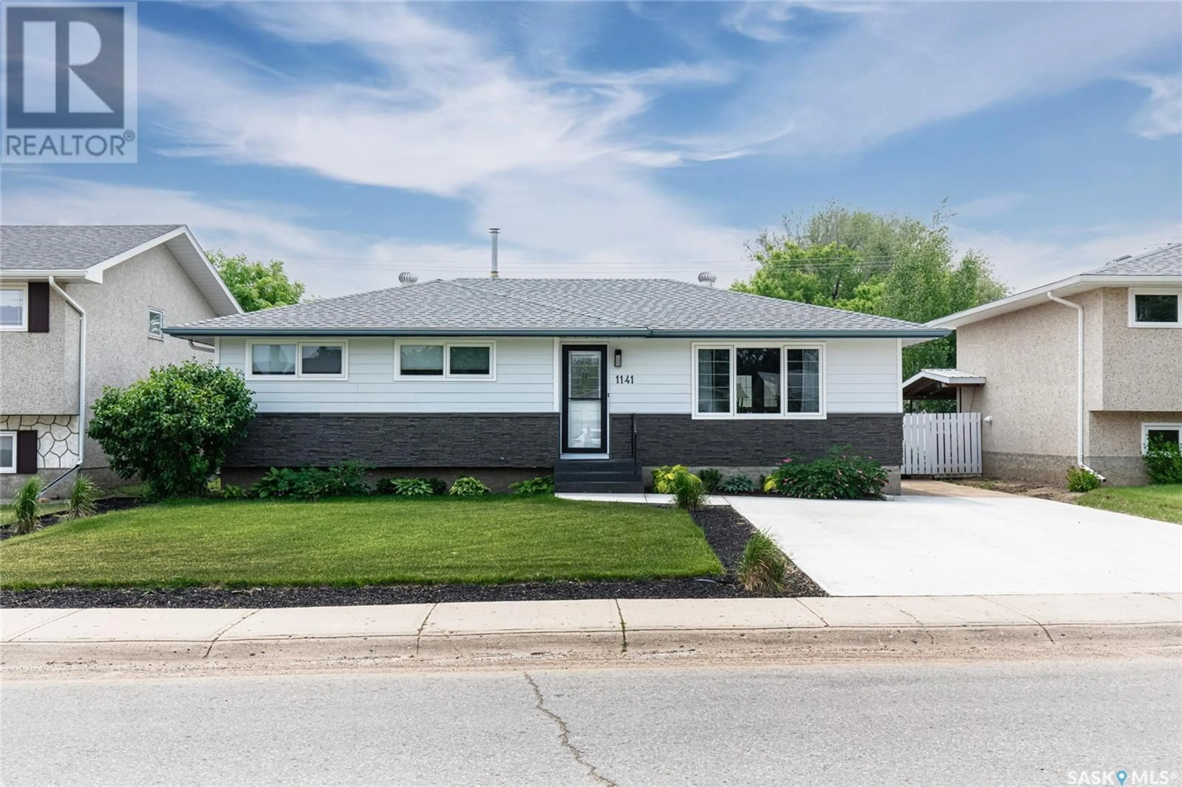 Home with vinyl exterior material, street for 1141 WARNER STREET, Moose Jaw Saskatchewan S6H6J8