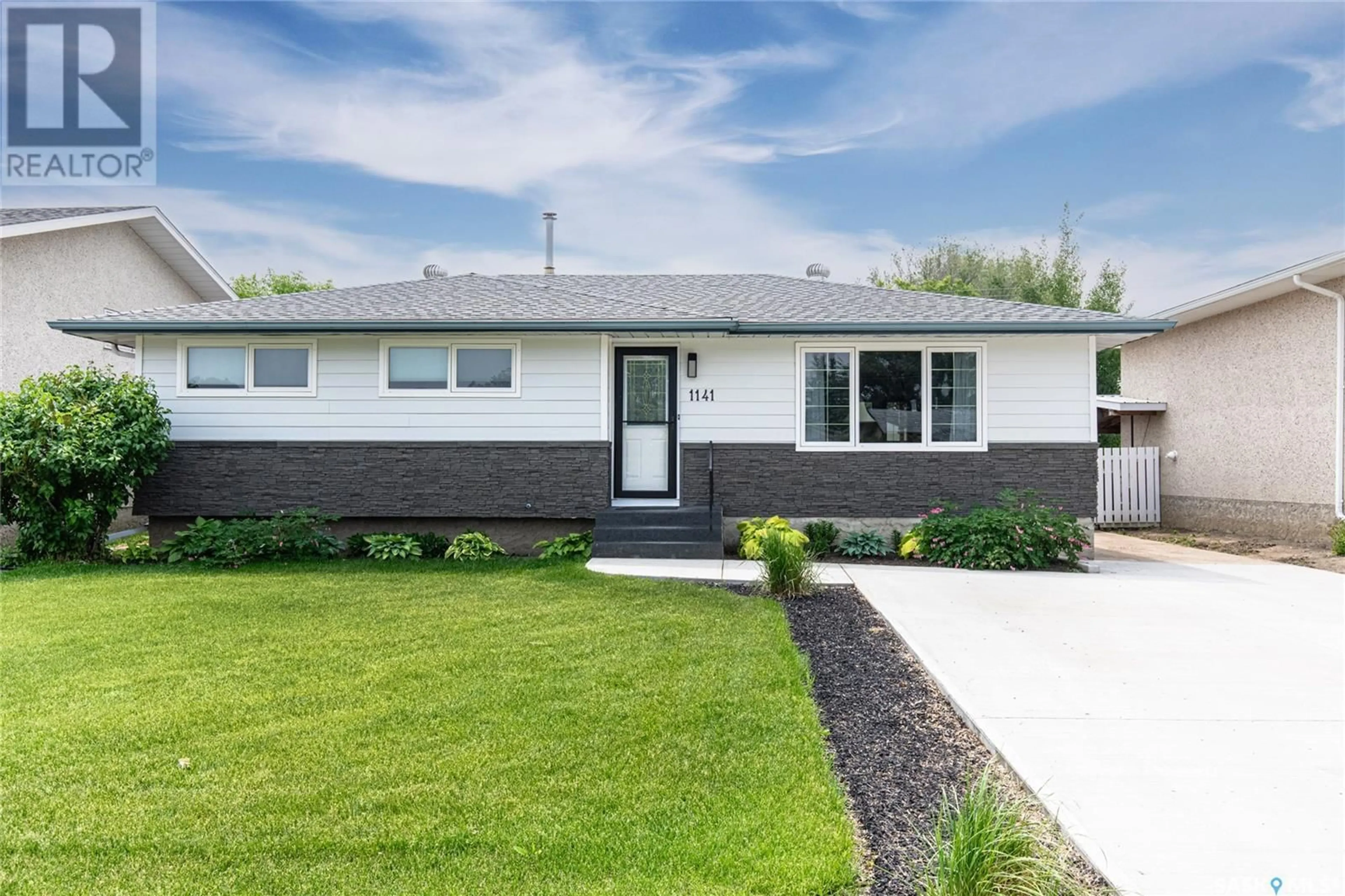 Home with vinyl exterior material, street for 1141 WARNER STREET, Moose Jaw Saskatchewan S6H6J8
