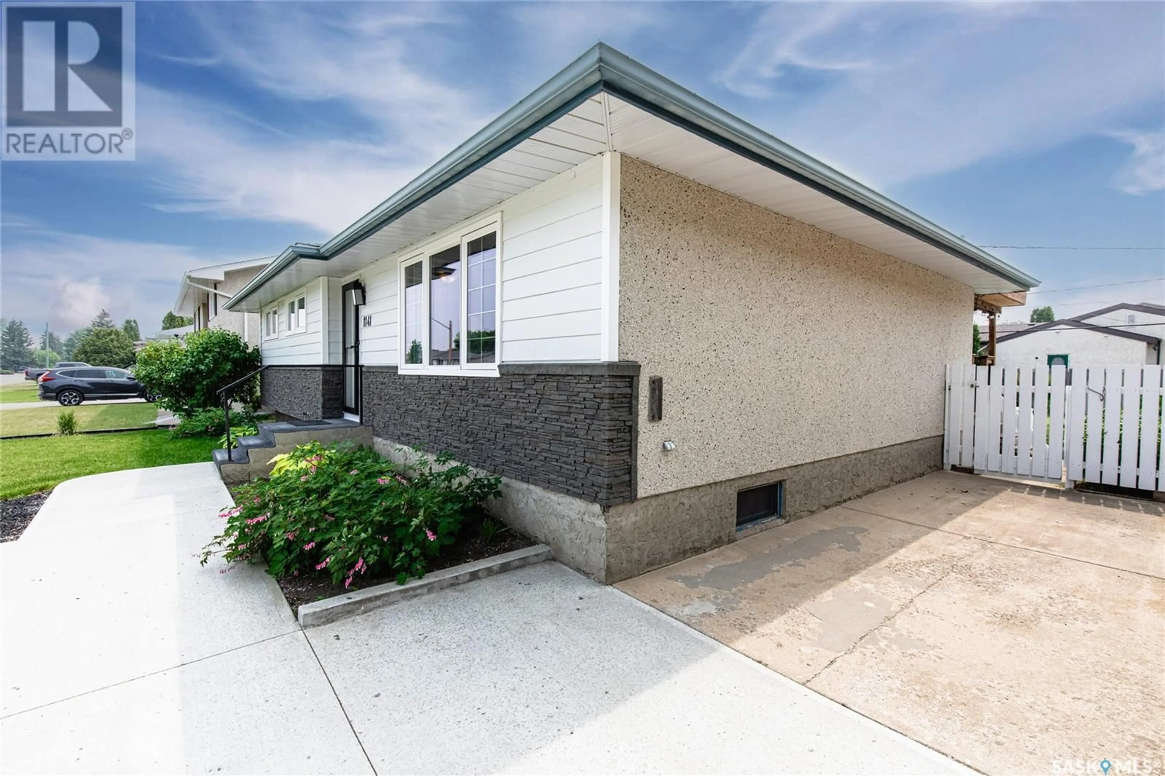 Home with vinyl exterior material, street for 1141 WARNER STREET, Moose Jaw Saskatchewan S6H6J8