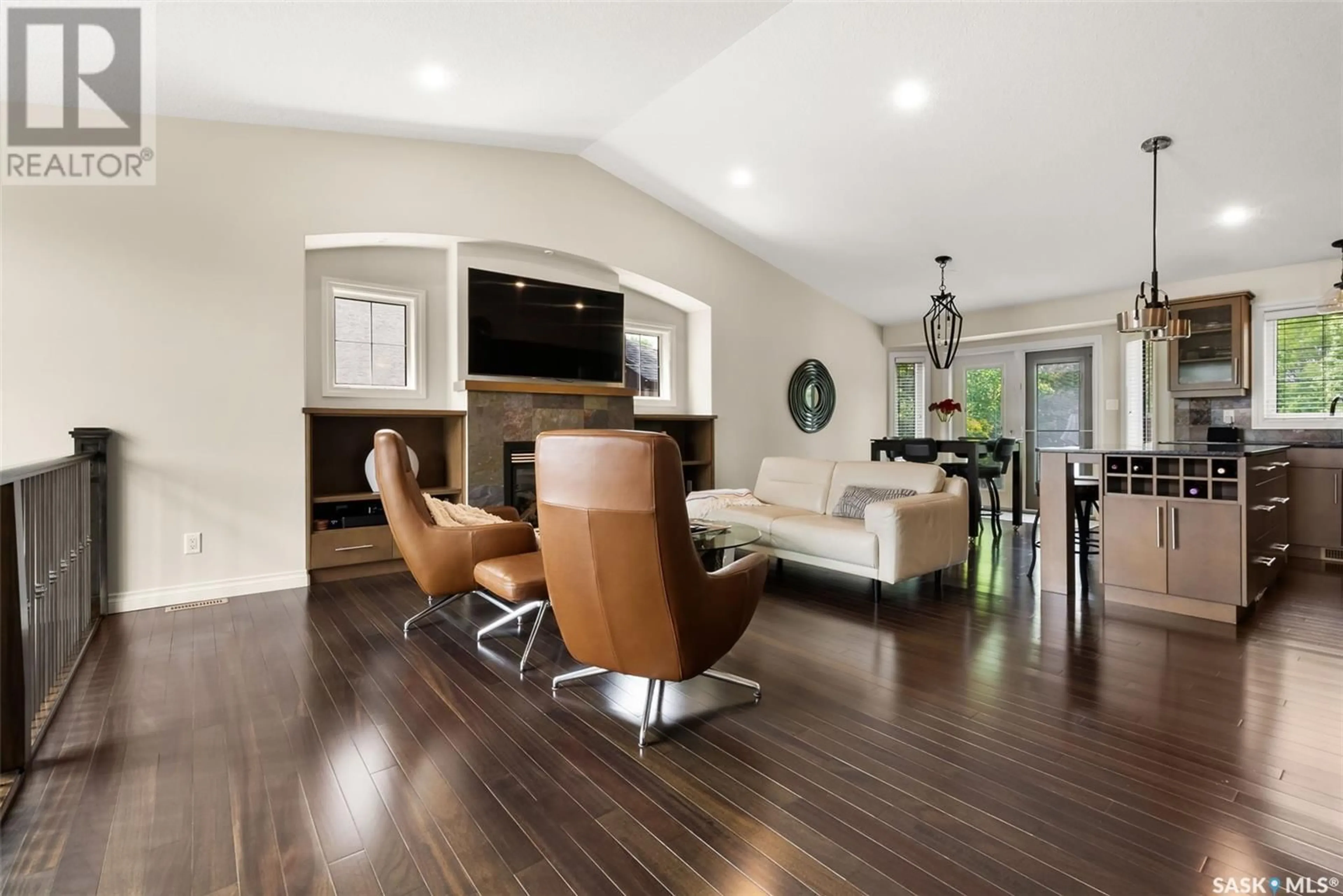 Living room with furniture, wood/laminate floor for 4930 GUDEREIT WAY, Regina Saskatchewan S4X4T8