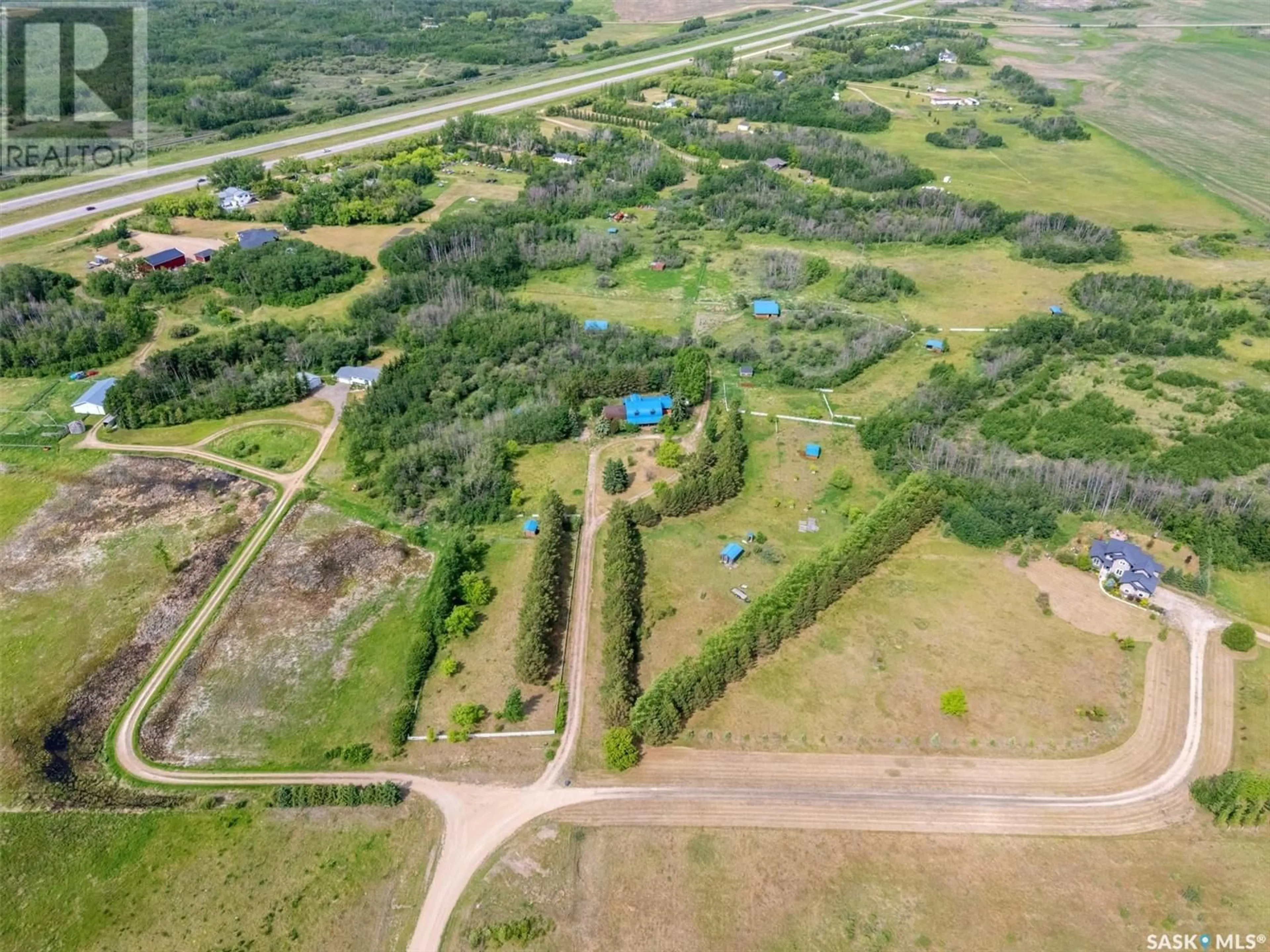 A pic from outside/outdoor area/front of a property/back of a property/a pic from drone, forest/trees view for Equestrian - DAISY LANE, Blucher Rm No. 343 Saskatchewan S0K0Y0