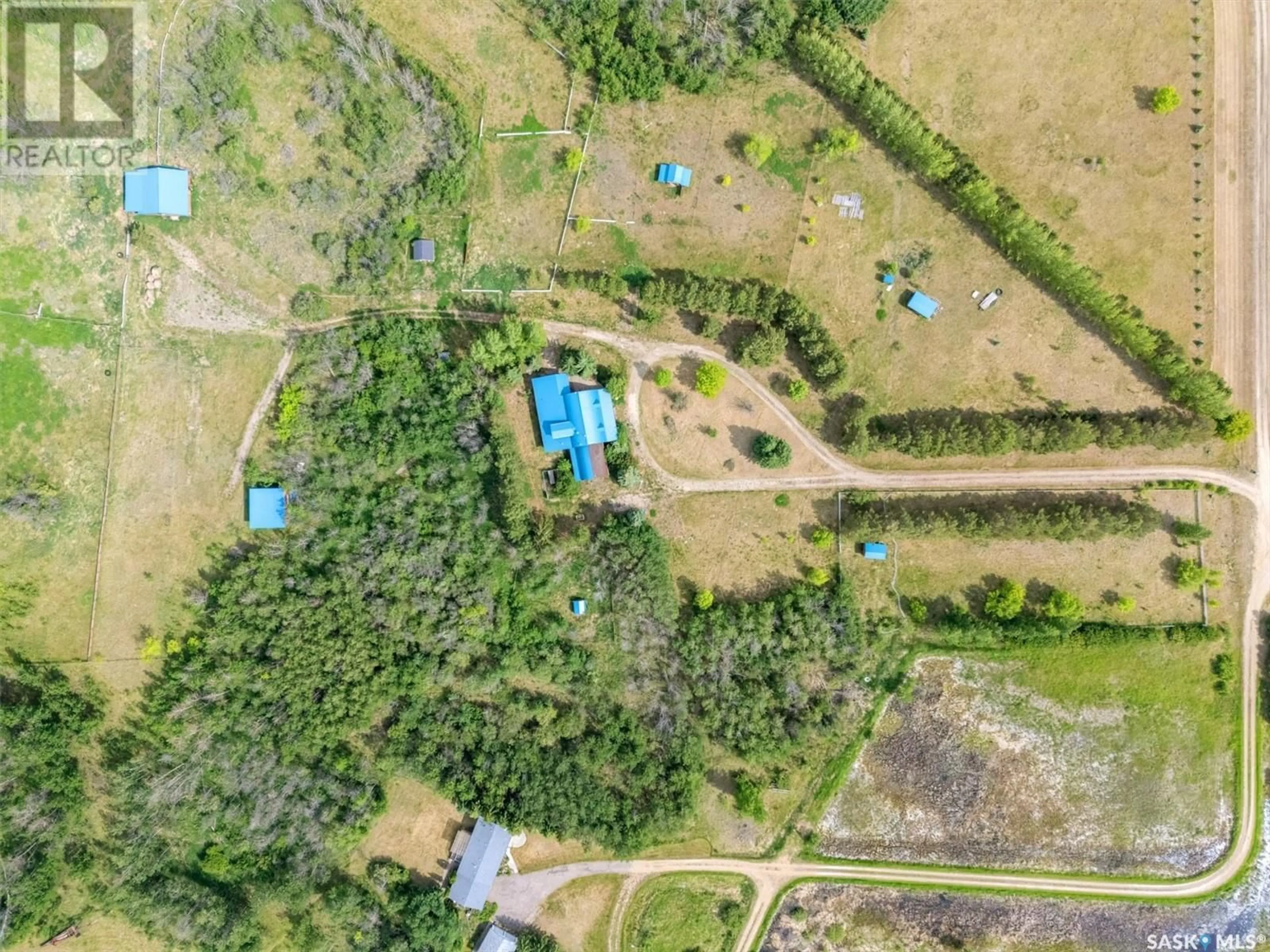A pic from outside/outdoor area/front of a property/back of a property/a pic from drone, forest/trees view for Equestrian - DAISY LANE, Blucher Rm No. 343 Saskatchewan S0K0Y0